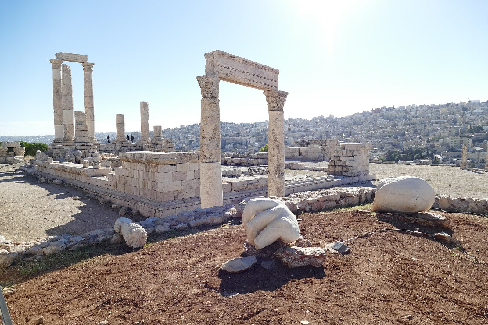 A close-up fragment of the stone hand of a colossus beside the temple at the Amman Citadel.
