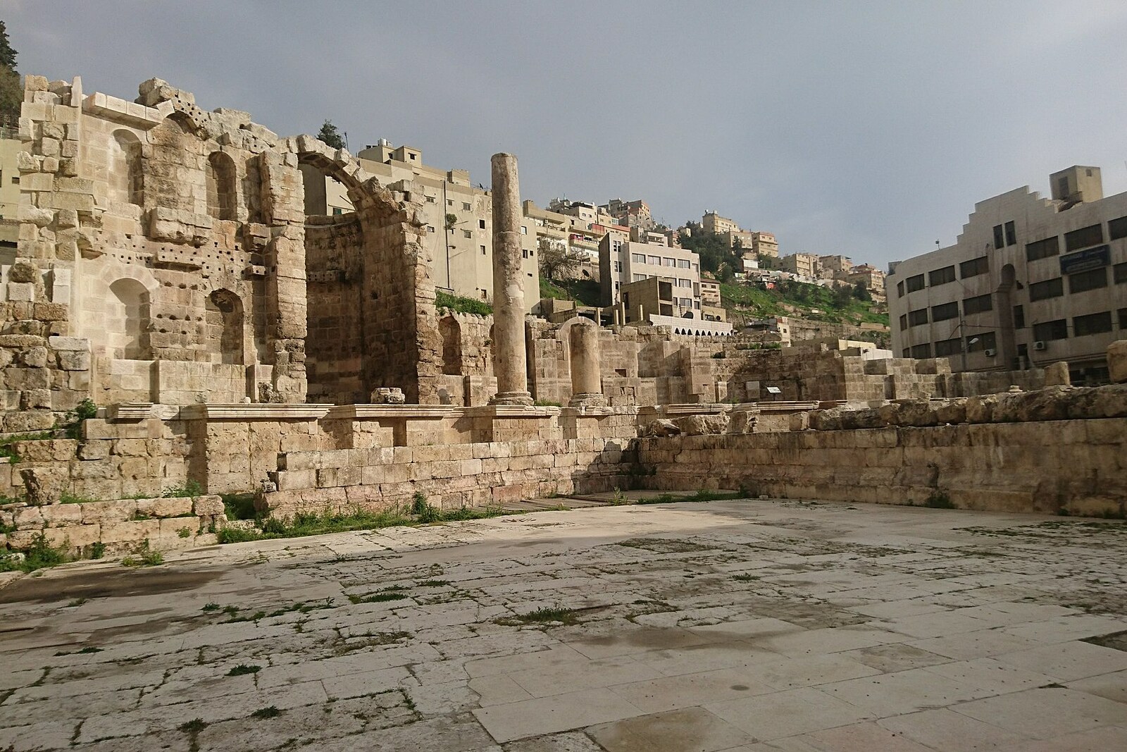 The ruins of the Roman Nymphaeum amid modern lower Amman.