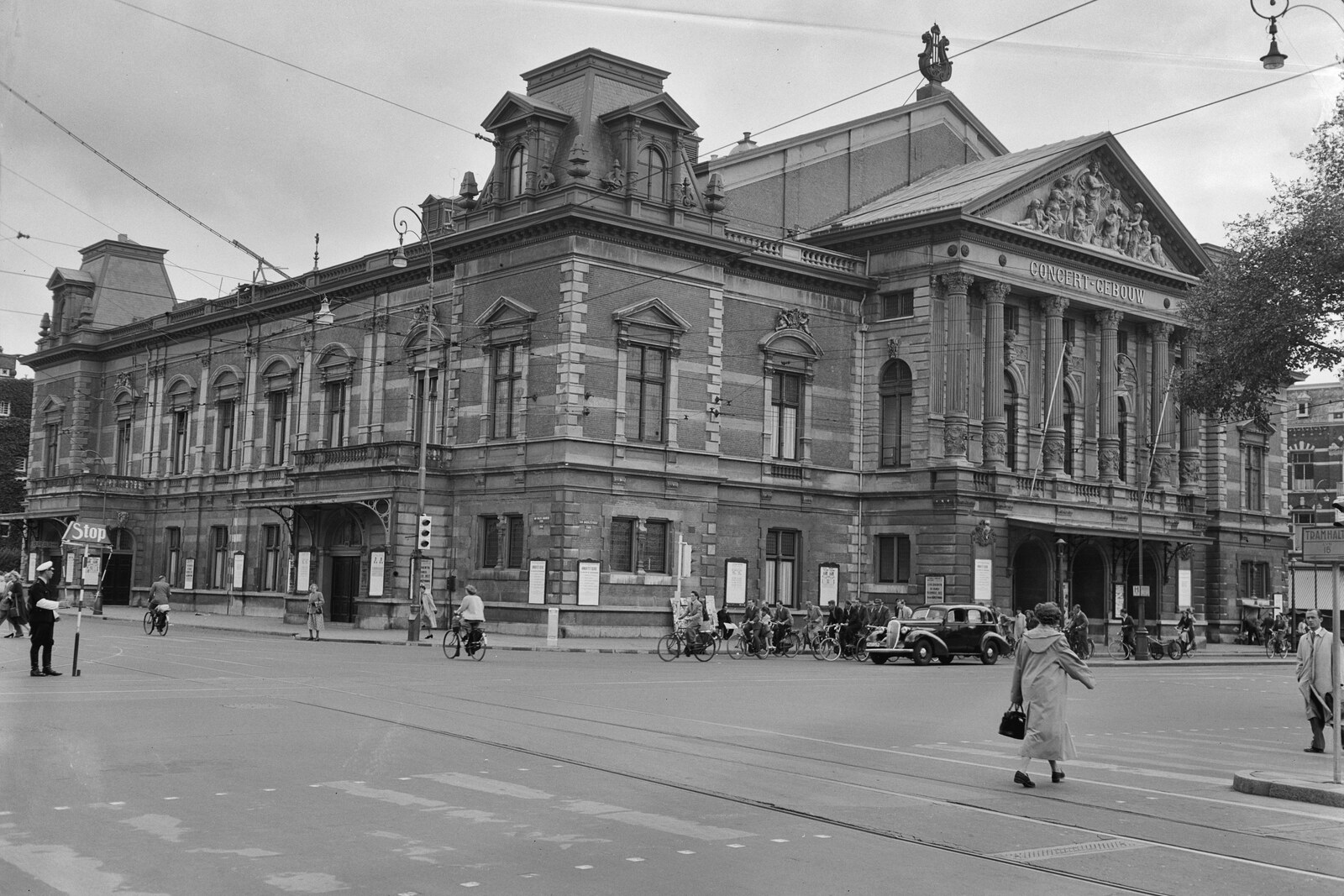 Black-and-white image of the Concertgebouw concert hall with a pediment and columns.