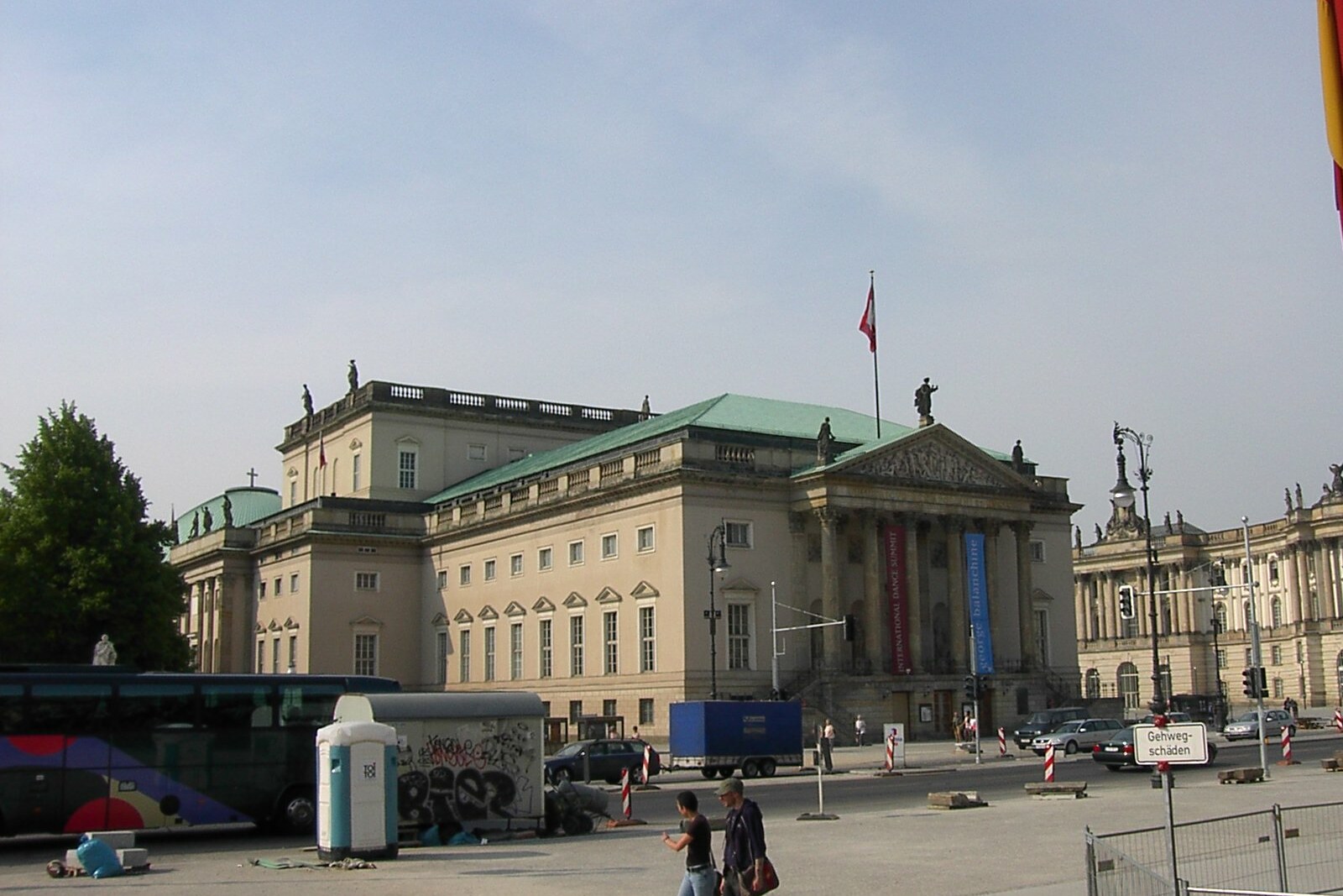 Facade of the Berlin State Opera with columns and flags