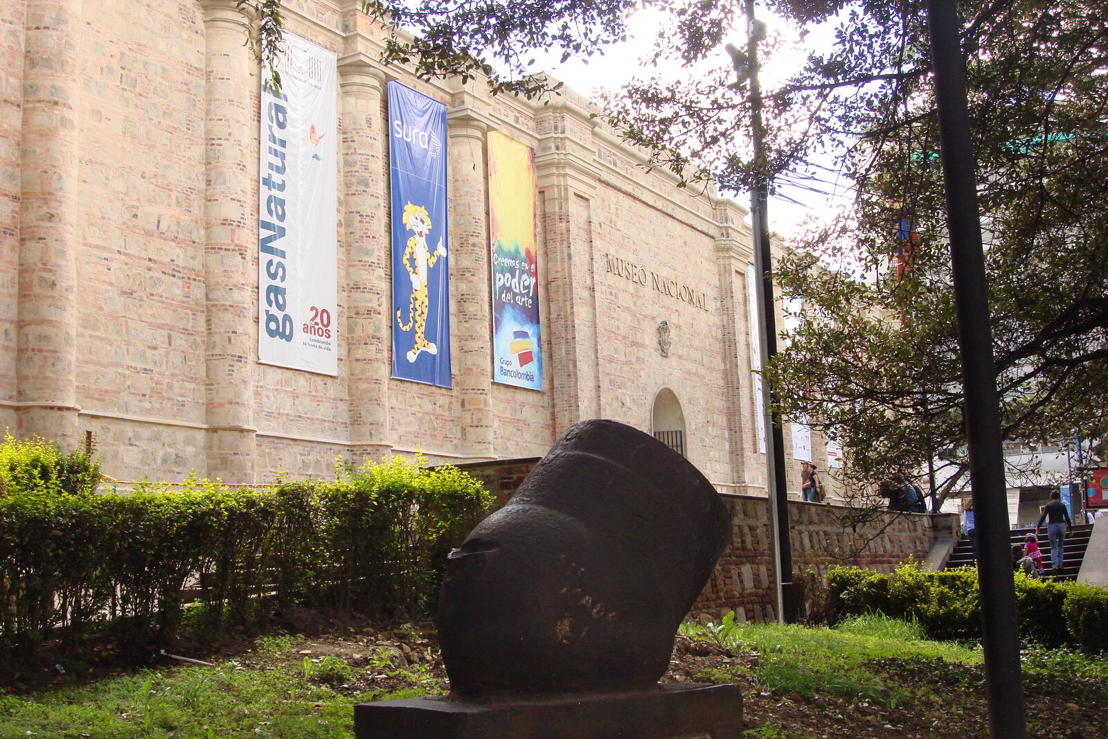 Gray stone building of the National Museum of Colombia with a central gate and towers
