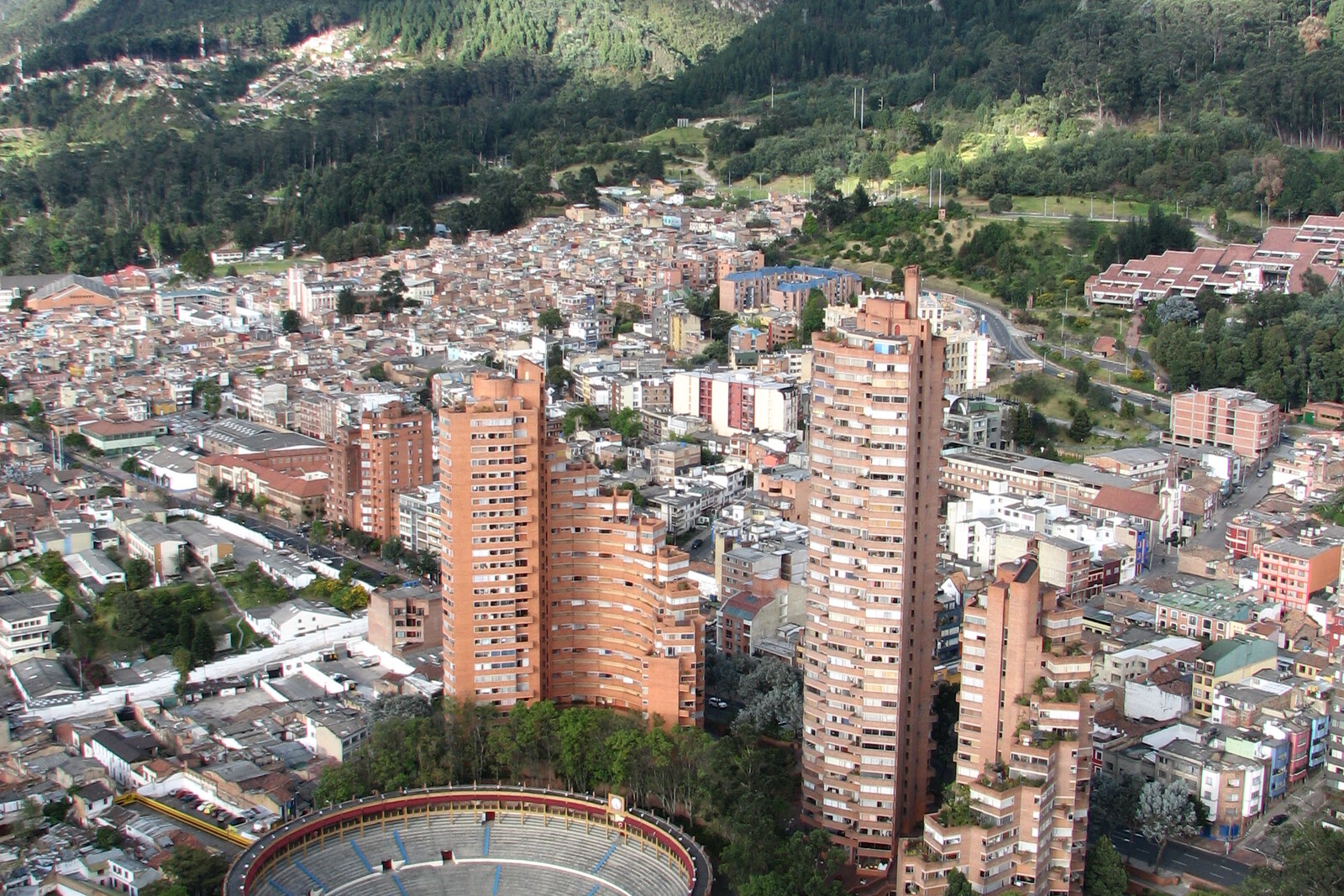 The round Torres del Parque towers rise above the round Santamaría arena