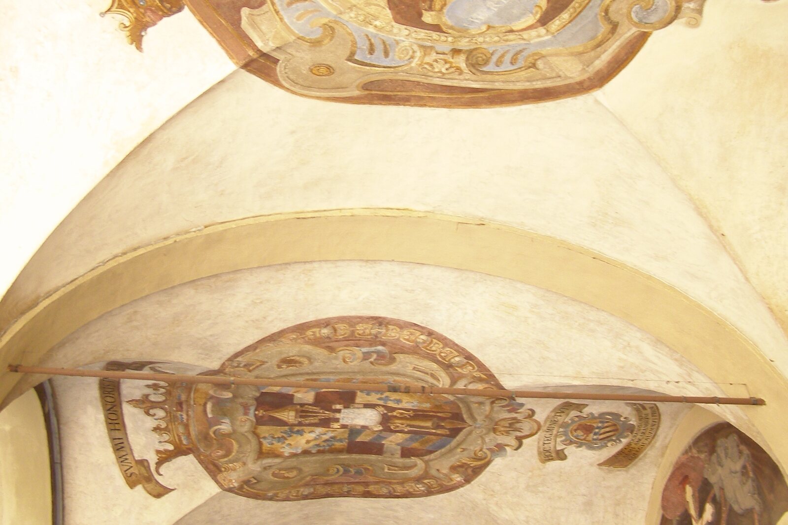 Courtyard of the Archiginnasio of Bologna with arcades and student coats of arms
