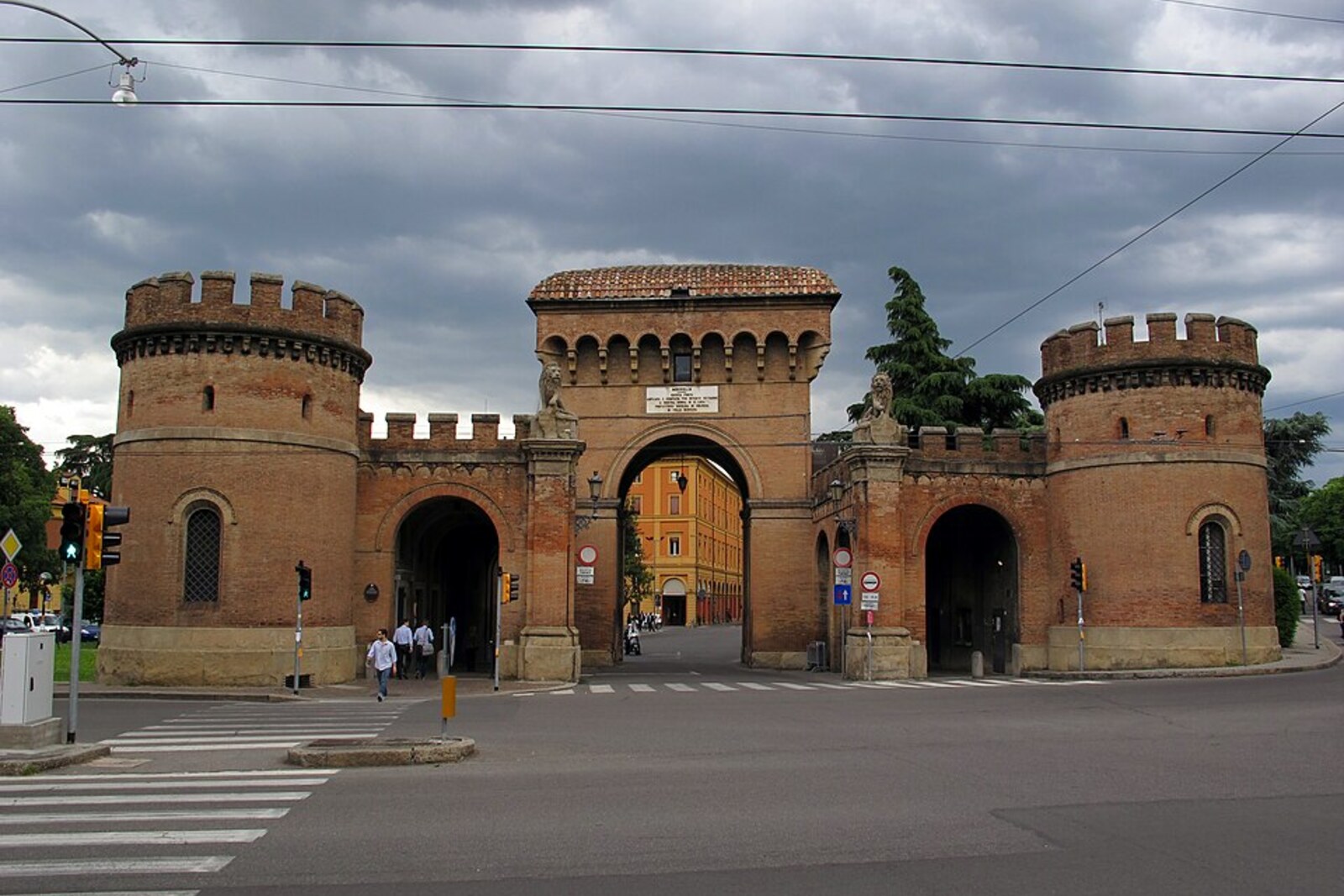 The brick Porta Saragozza gate at the beginning of the Portico of San Luca