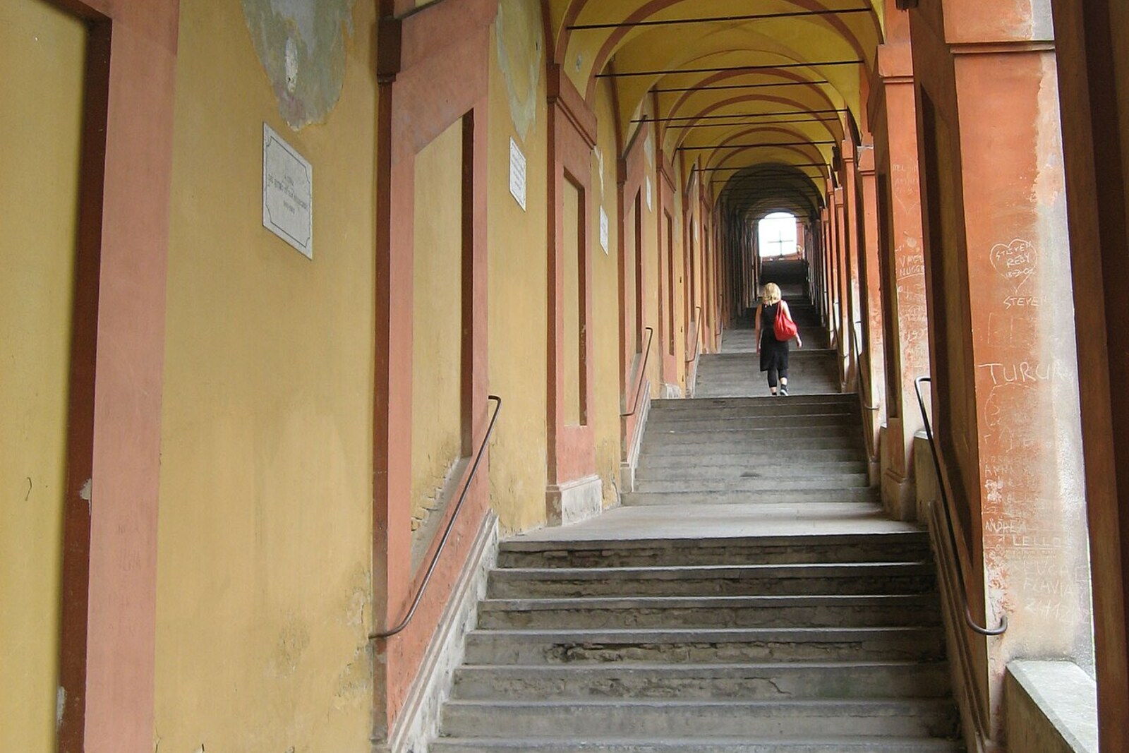 A row of arches of the Portico of San Luca on the level section