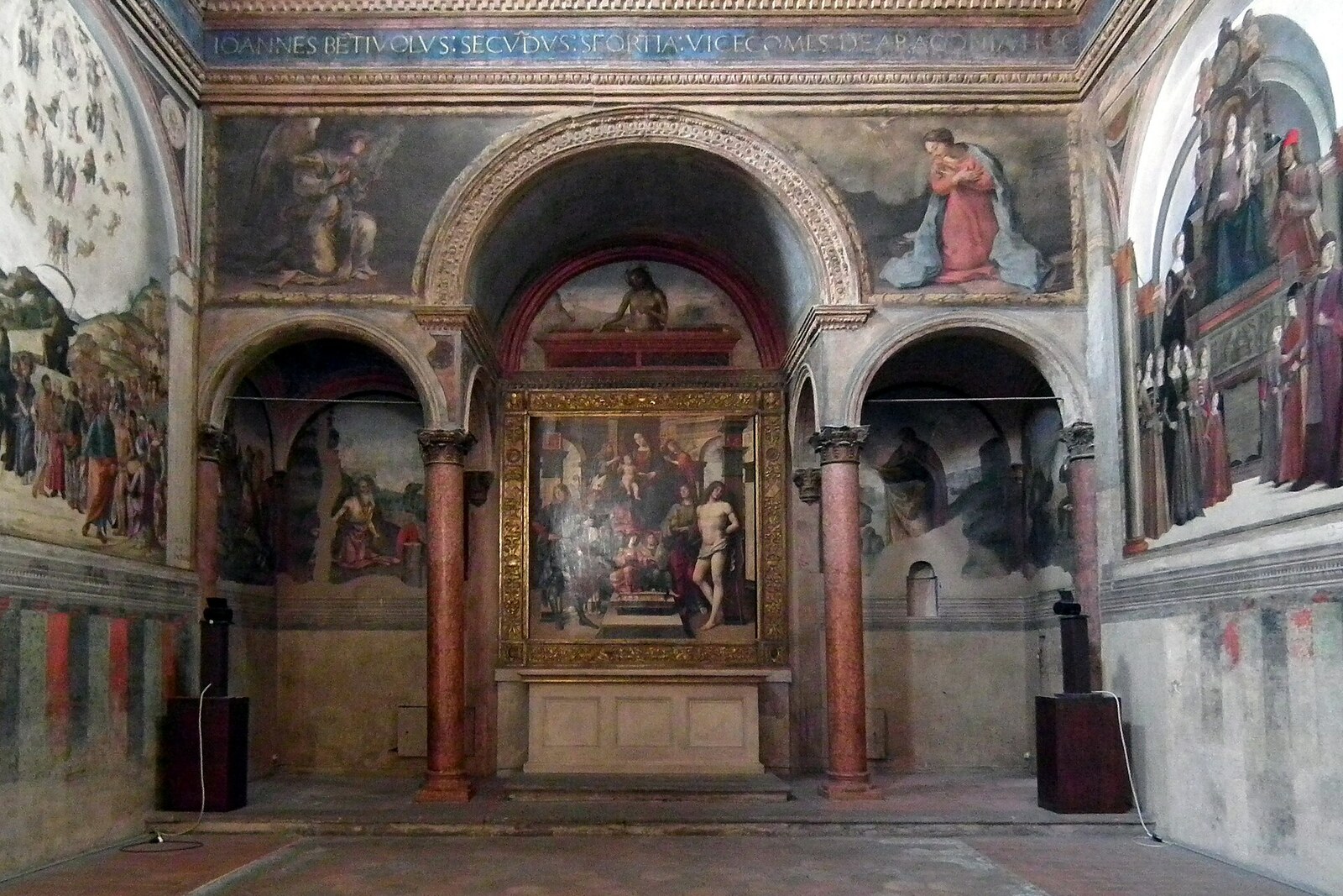The interior nave of the Basilica of San Giacomo Maggiore, with arches and decorations