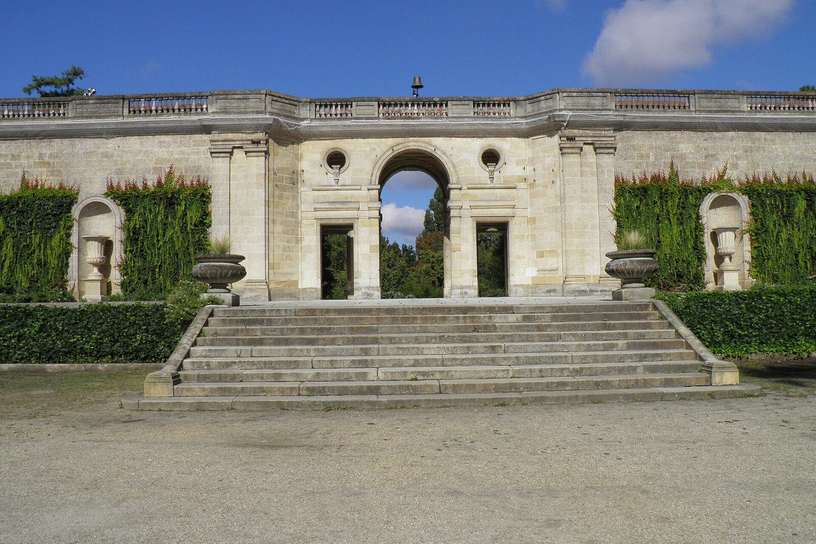 The pond, footbridges, and leafy paths of Jardin Public in Bordeaux.