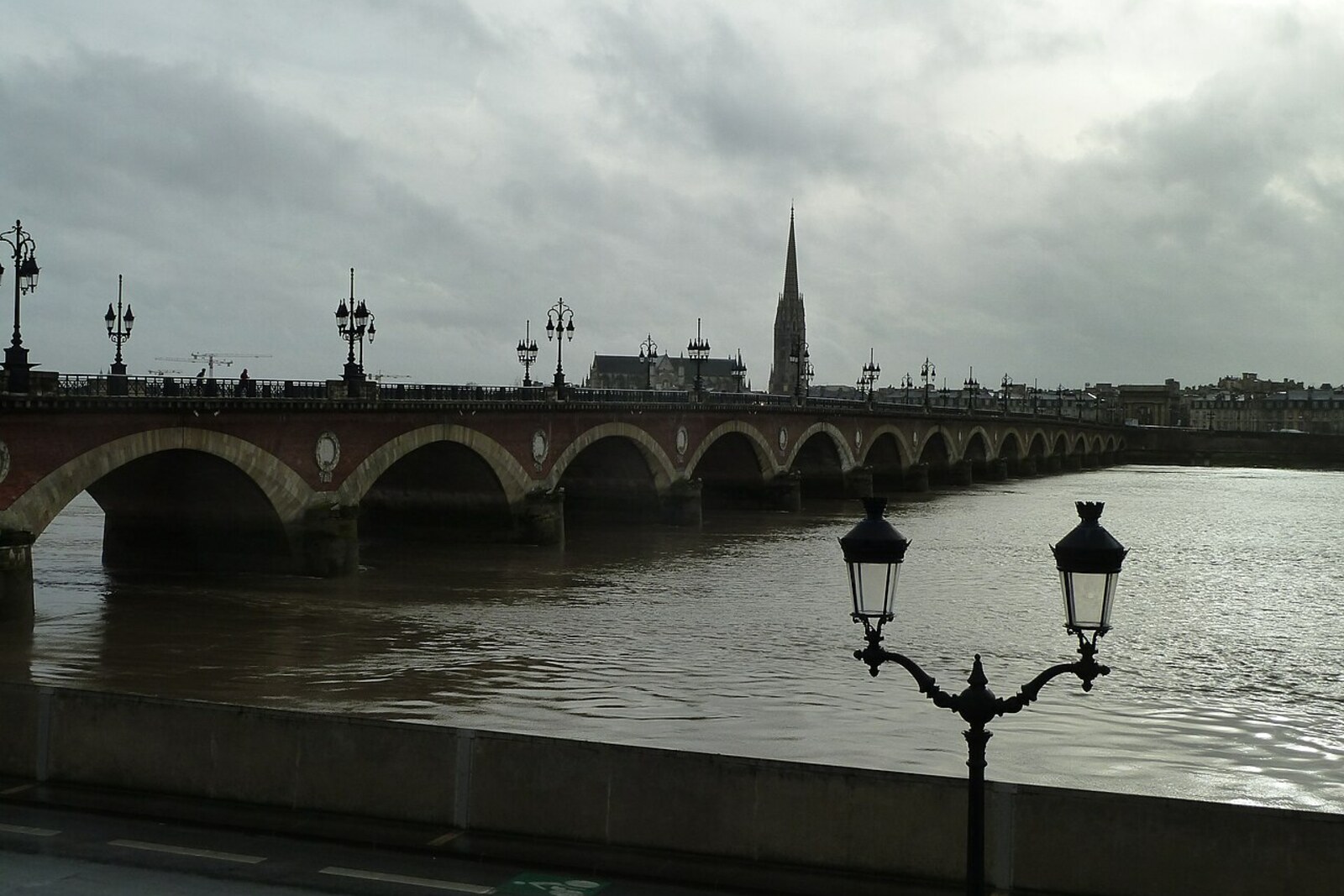 The stone Pont de Pierre bridge with arches crossing the Garonne