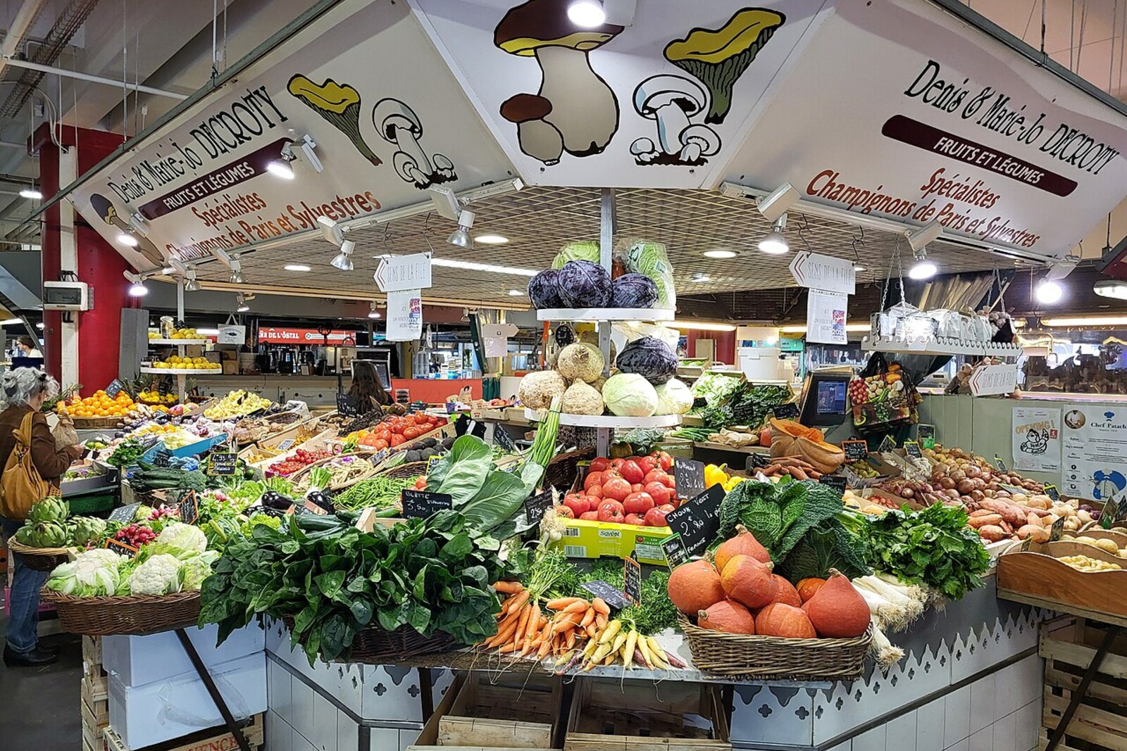Covered market at Capucins with colorful stalls and shoppers