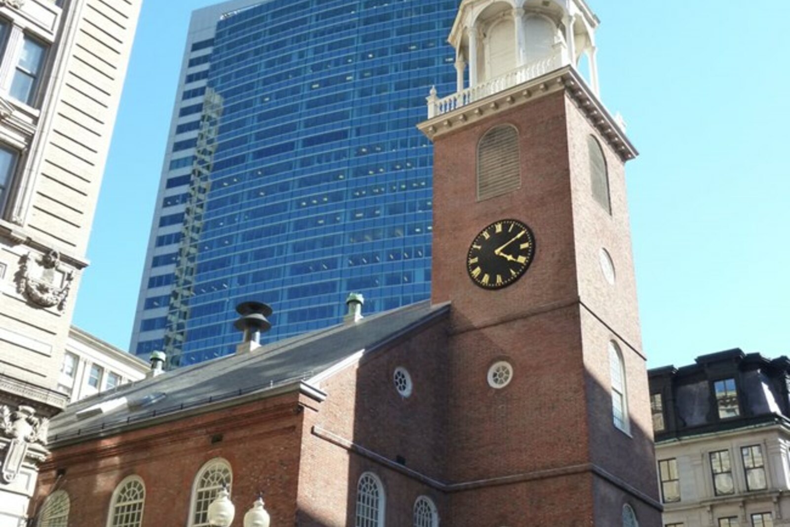 Old South Meeting House on Washington Street, with a brick tower and spire.
