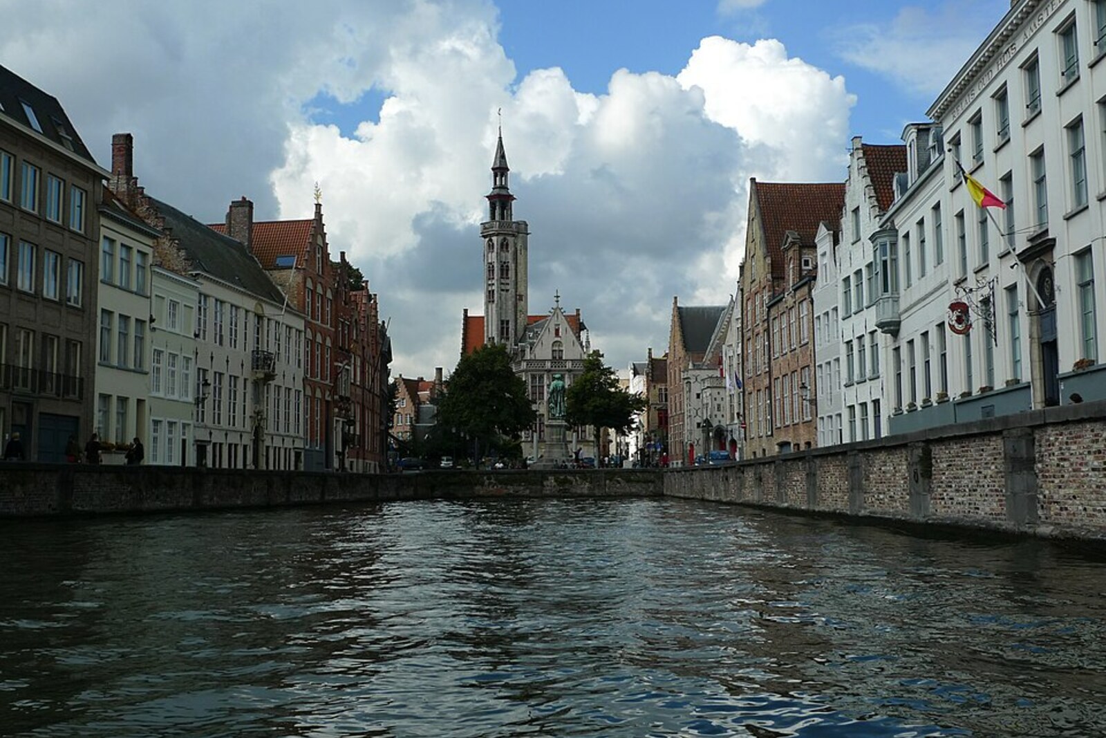 View of Jan van Eyckplein and a canal in Bruges.