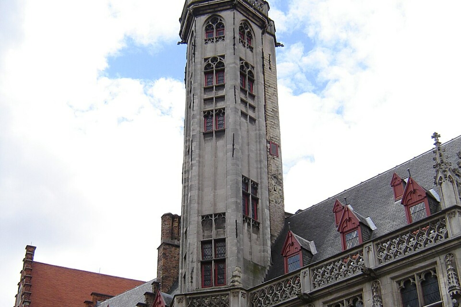 Facade and tower of the Poortersloge in Bruges.