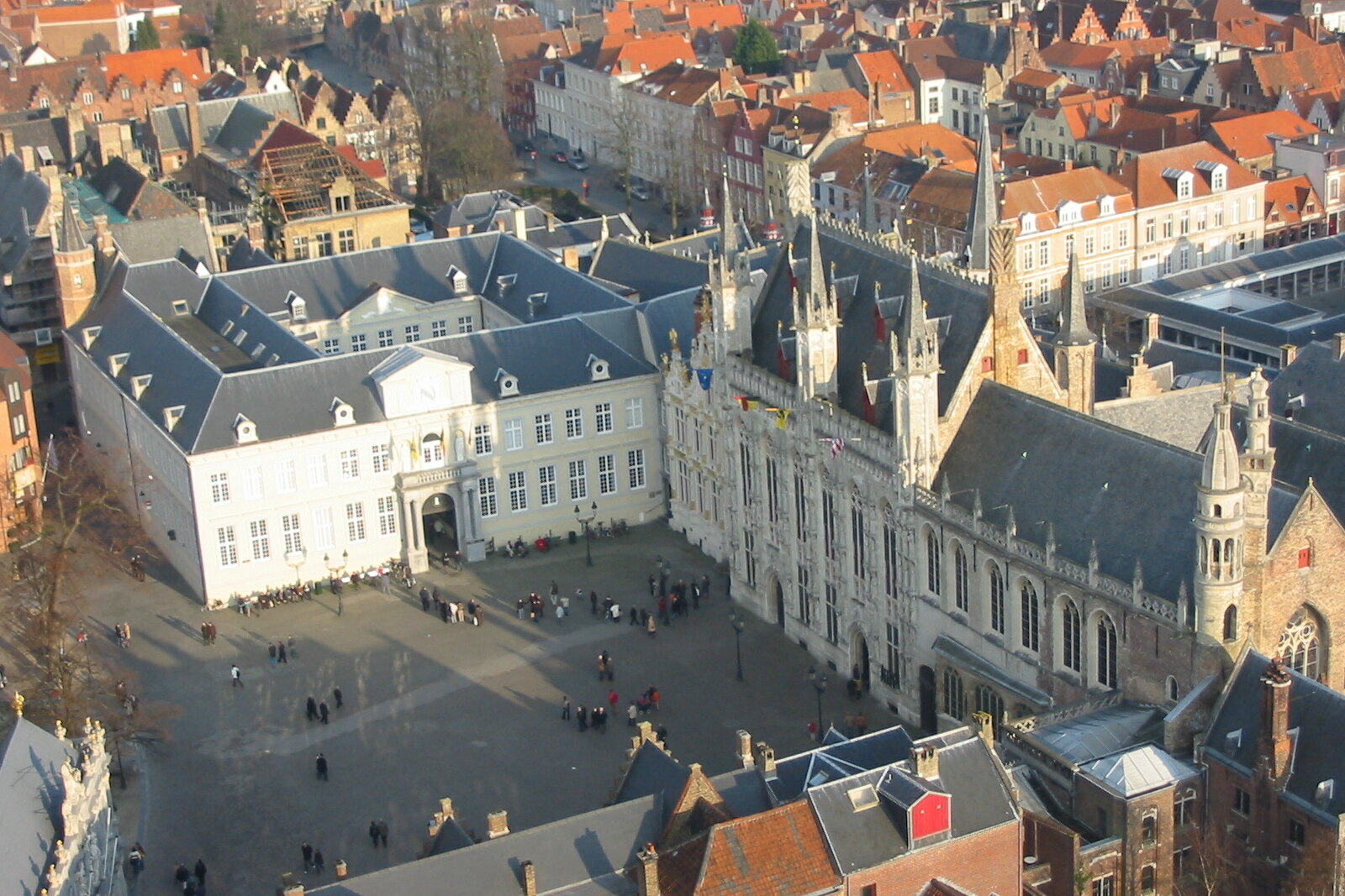 Burg Square in Bruges with the city hall, basilica, and historic façades.