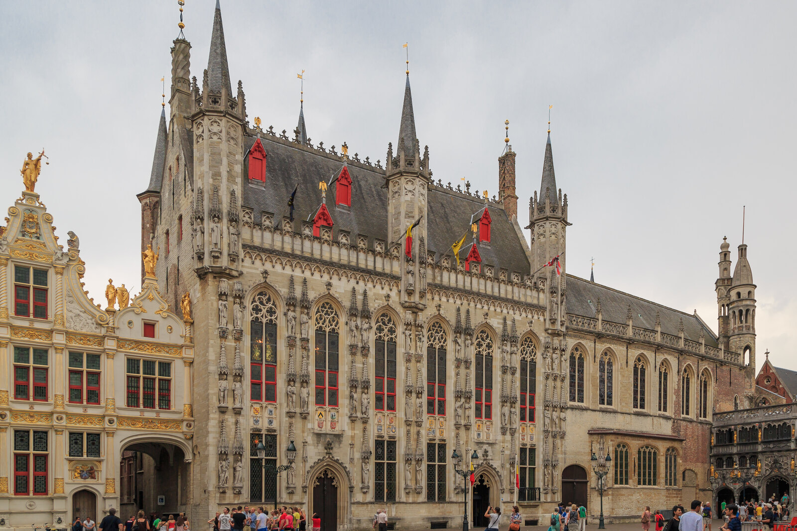 The Gothic façade of Bruges City Hall on Burg Square.