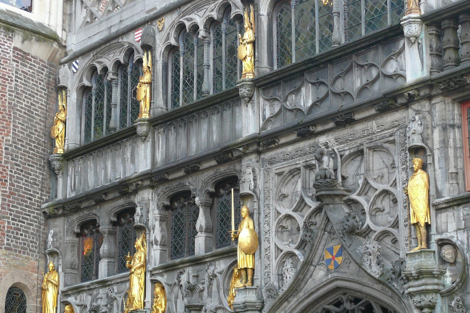 The Basilica of the Holy Blood on Burg Square, with its dark facade and entrance.