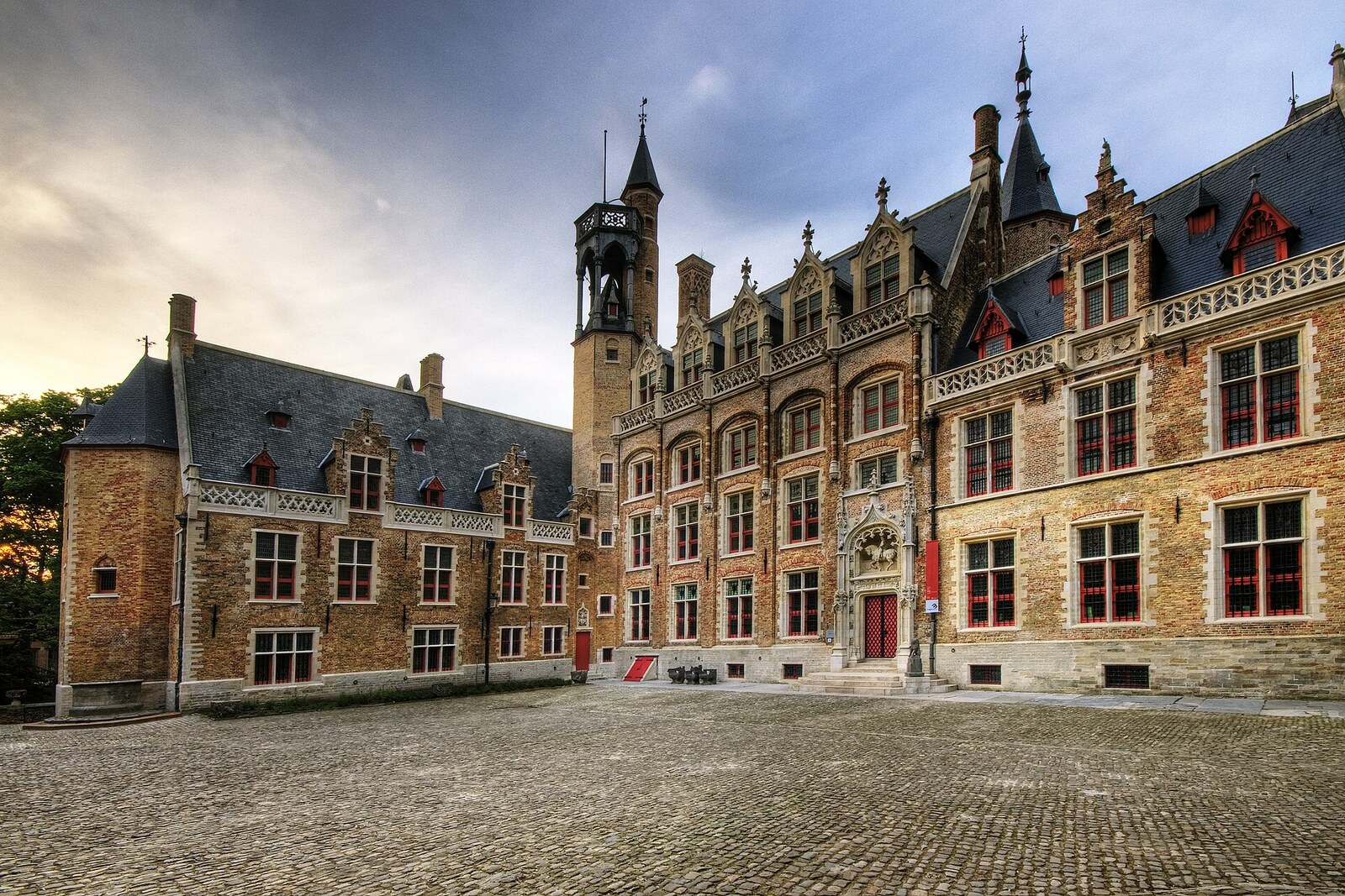 The Gothic Gruuthuse Palace in Bruges, with a tower and cornices.