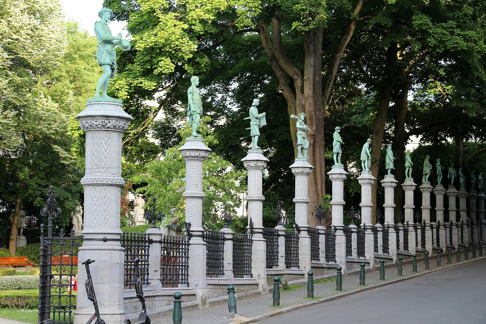 Square du Petit Sablon with bronze figures on its fence.