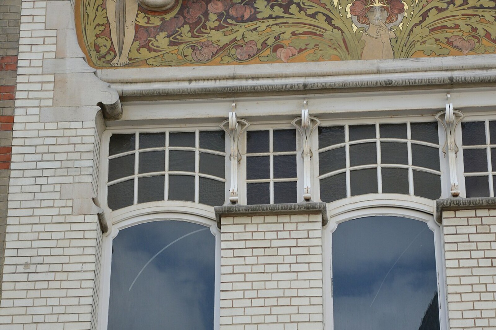 The patterned facade of Roosenboom House with floral panels and wrought-iron lines.