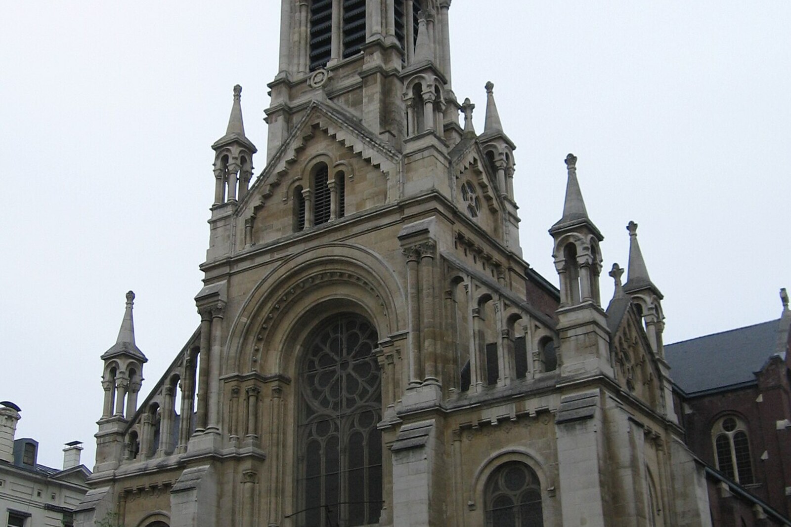 The Church of St. Gilles with its tall tower and eclectic façade.