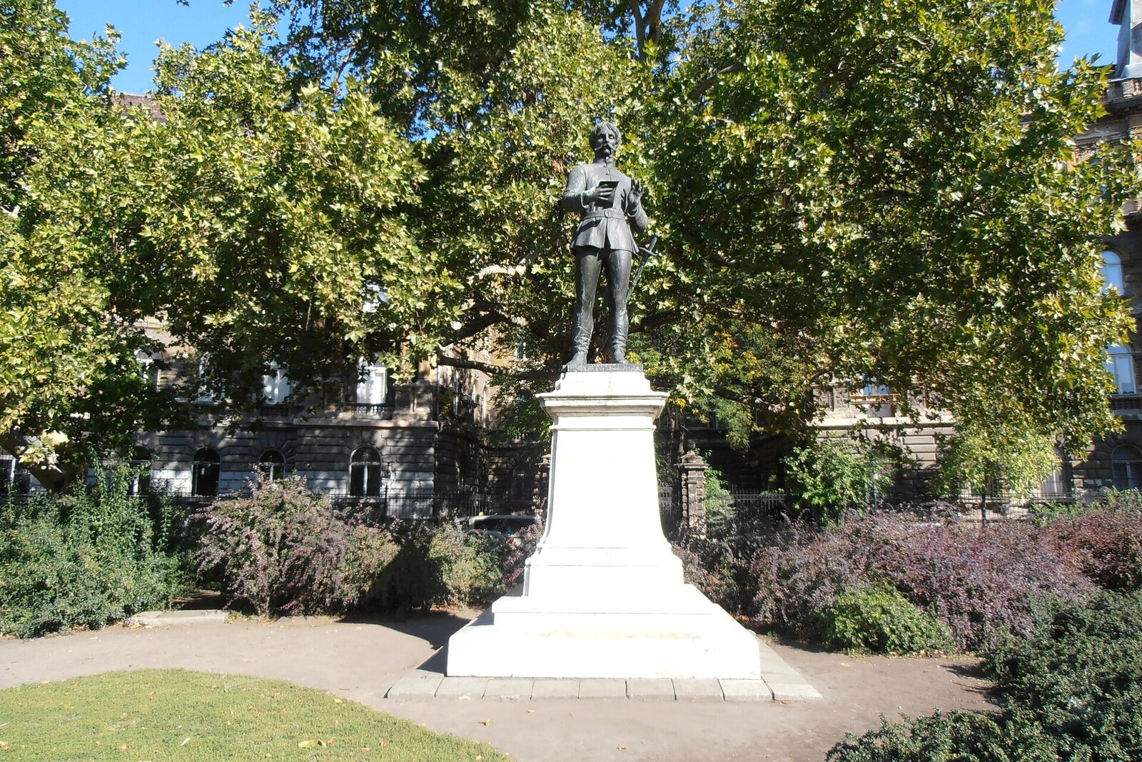 The statue and green square of Kodály Körönd on Andrássy Avenue in Budapest.