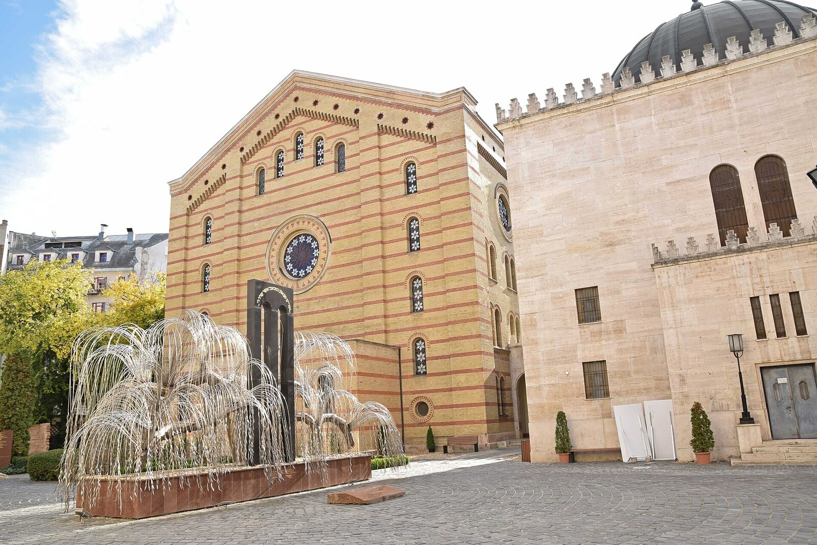 The façade of the Dohány Street Synagogue with onion domes and Eastern decoration.