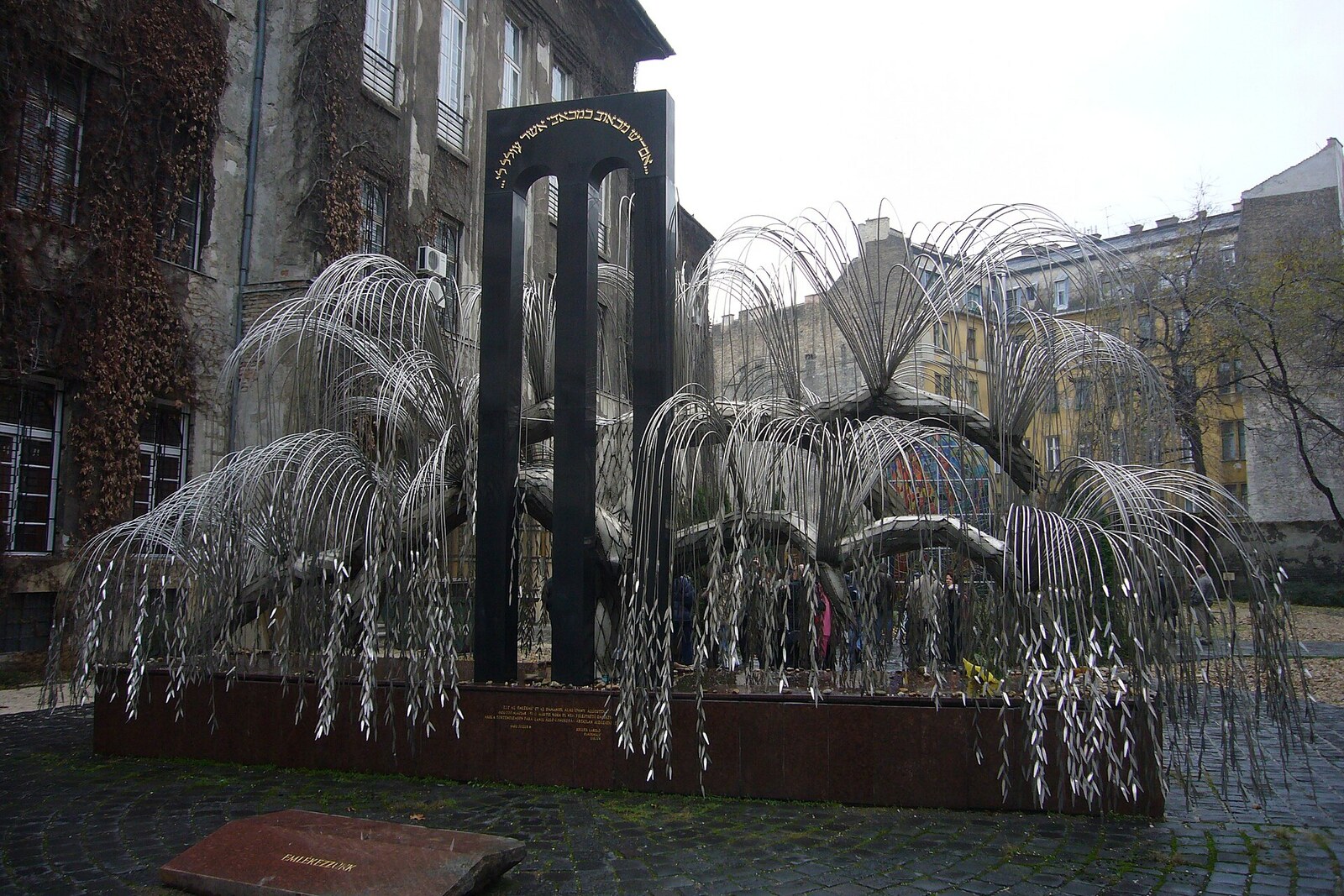 A metal weeping willow—the Emanuel Tree—with the names of Holocaust victims.