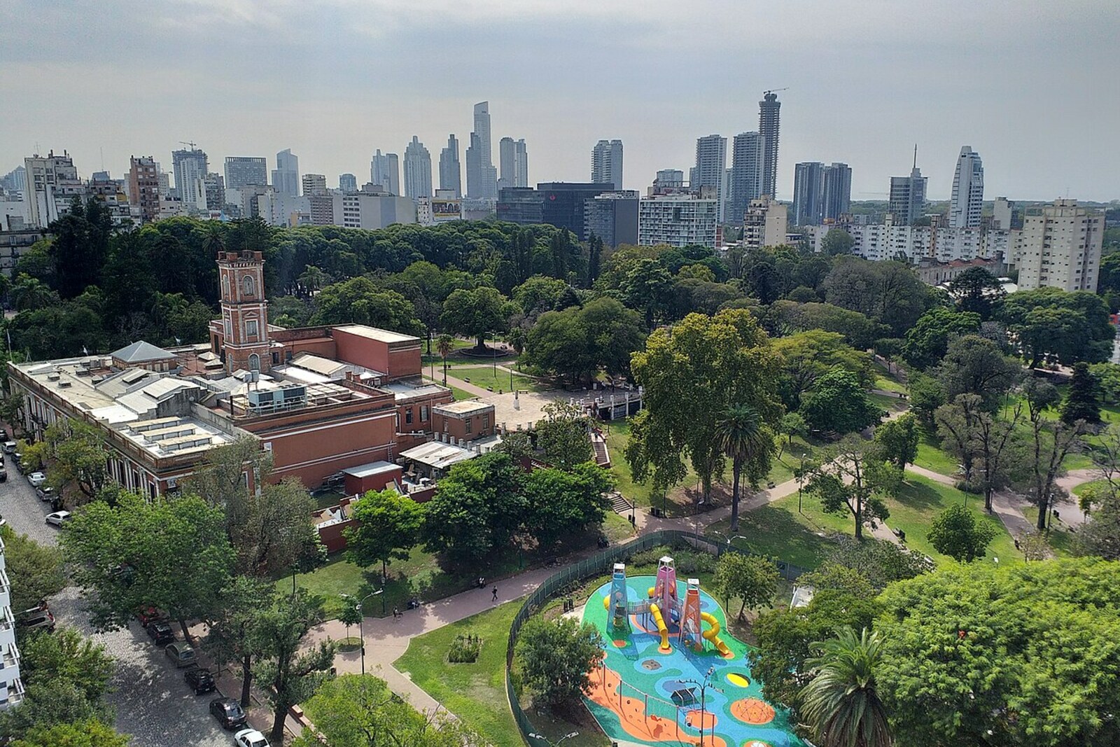 A green city park with paths and trees