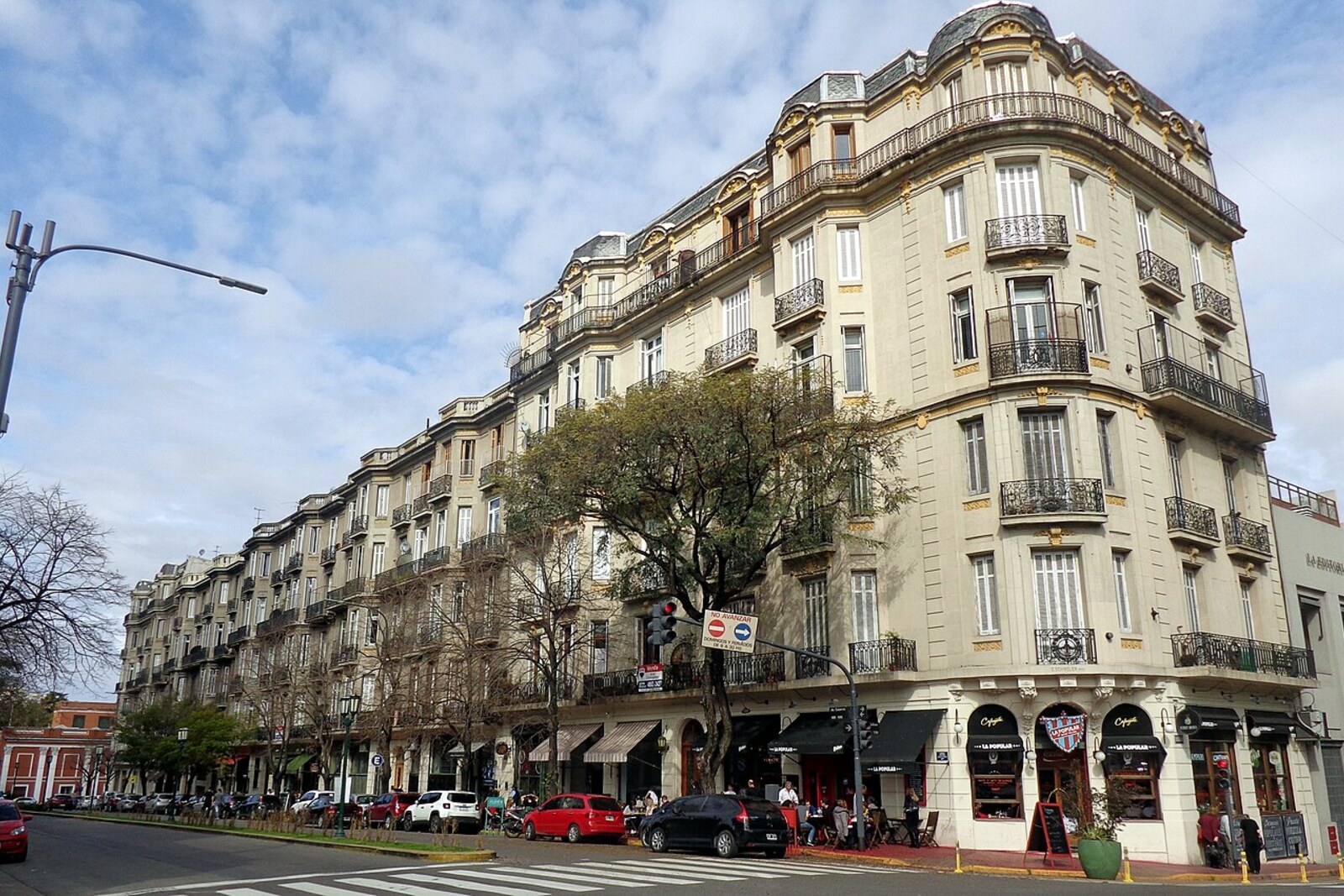 A row of historic houses with domed corner towers