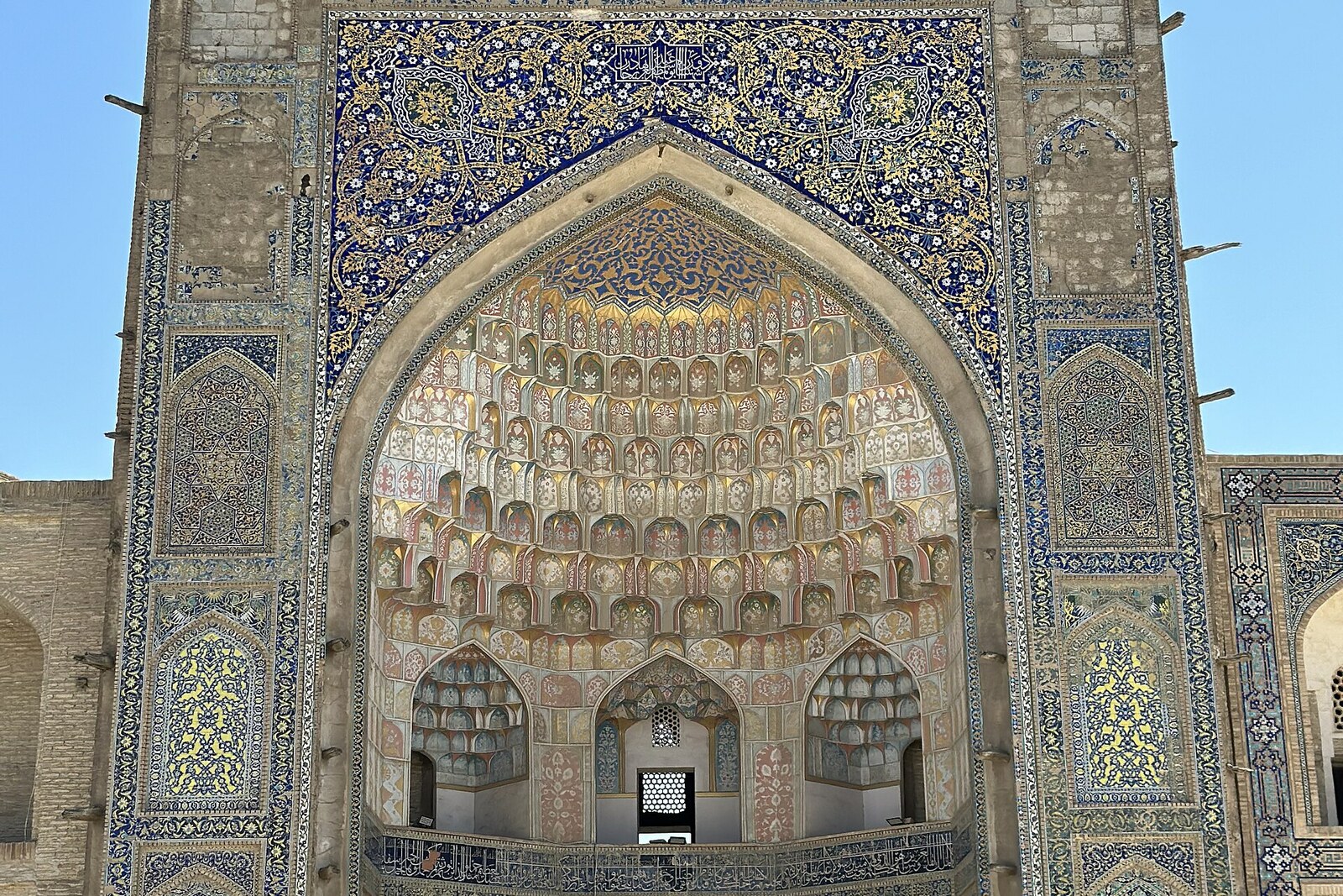 The richly decorated portal of Abdulaziz Khan Madrasah.