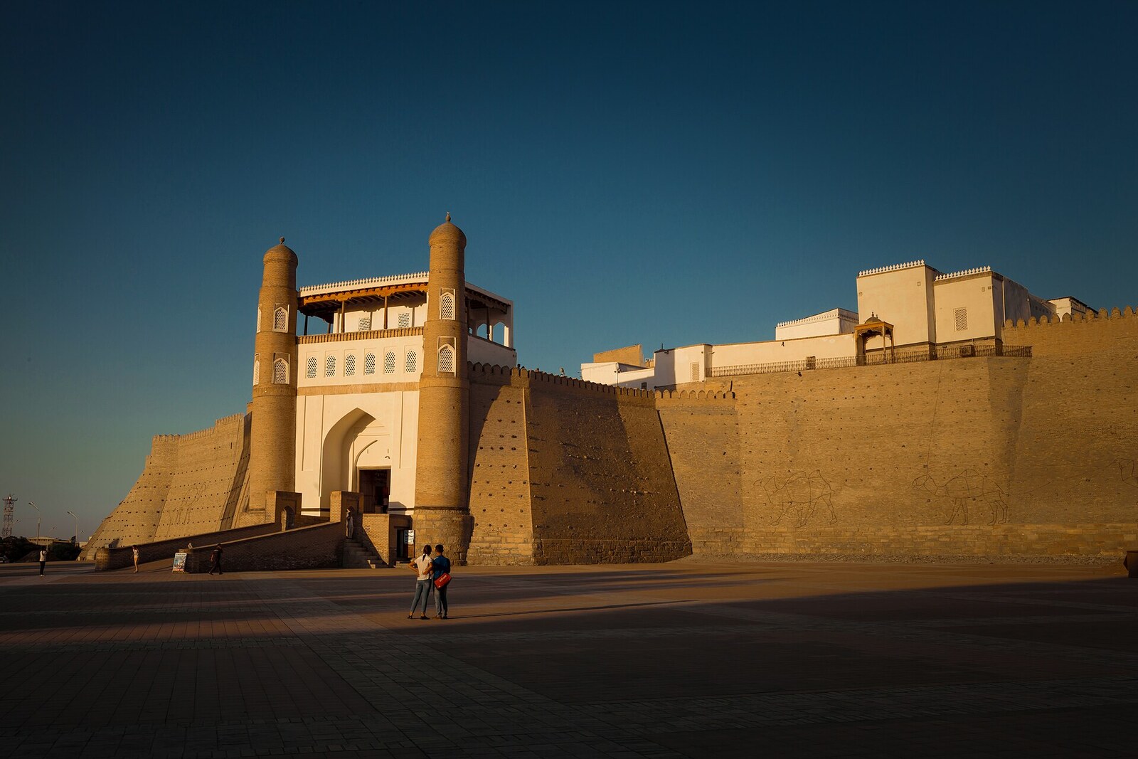 The massive walls and entrance ramp of the Ark of Bukhara fortress.
