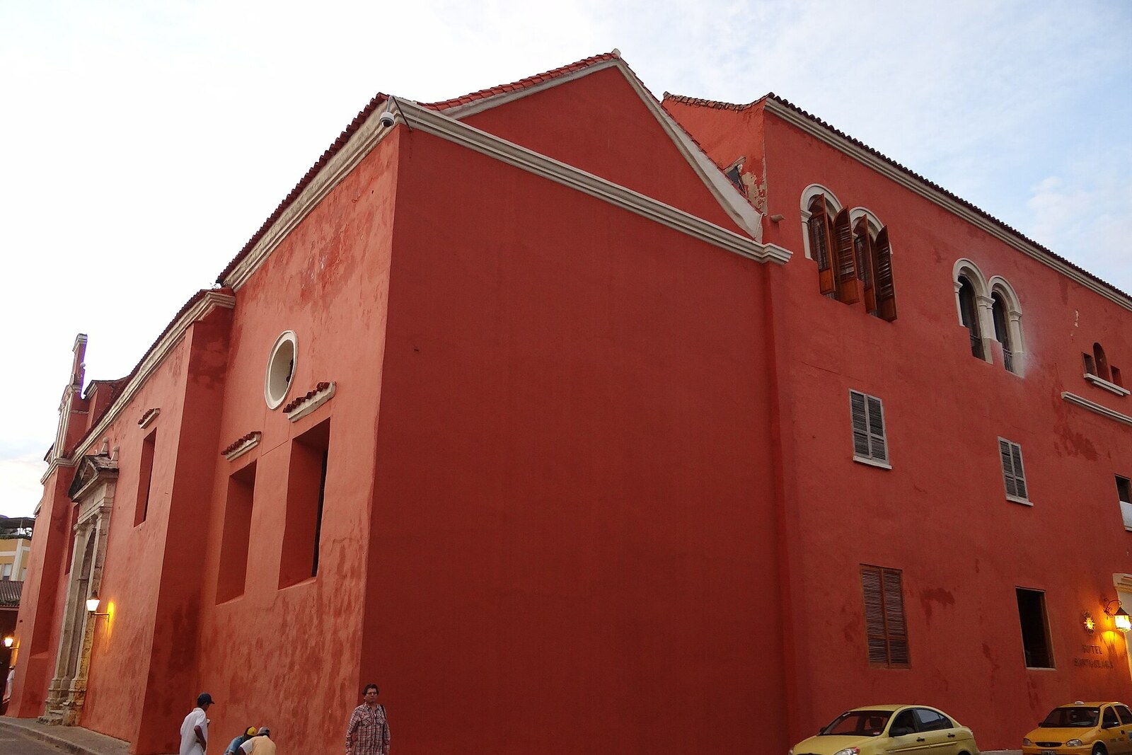 Massive walls and the bell tower of the Convent of Santa Clara against the city wall
