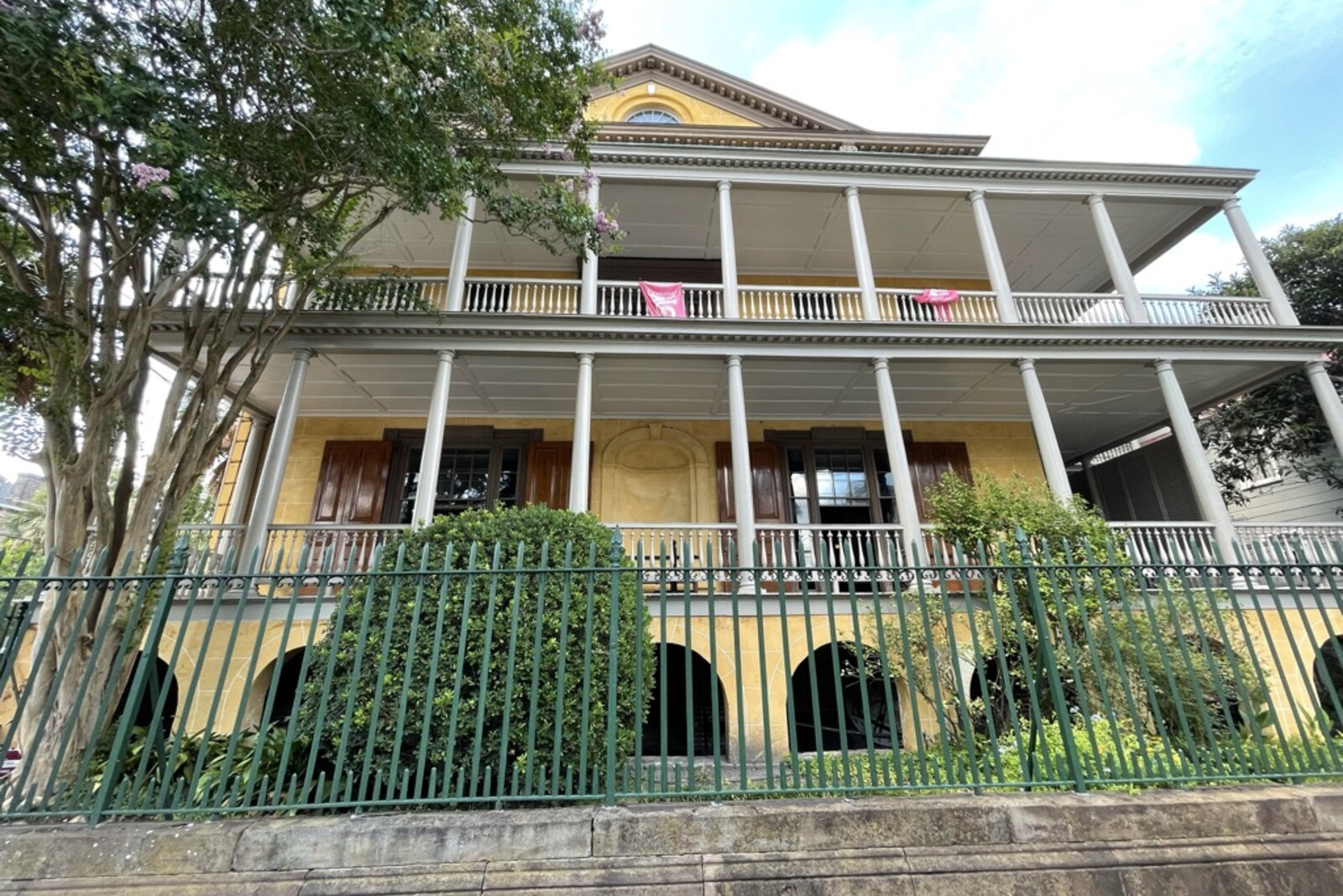 Aiken-Rhett House with a brick facade and greenery.