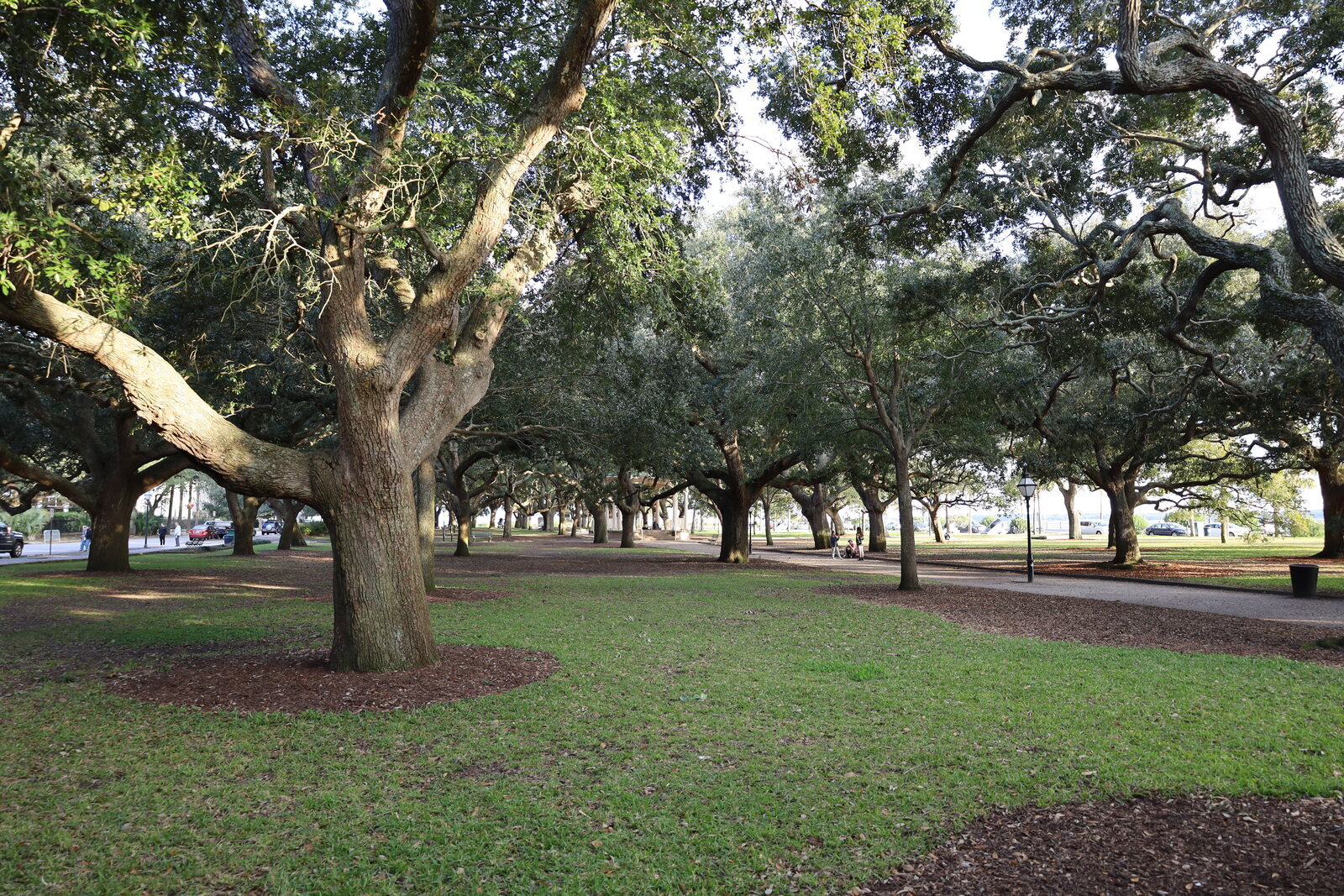 White Point Garden with paths, trees, and memorial features by The Battery.
