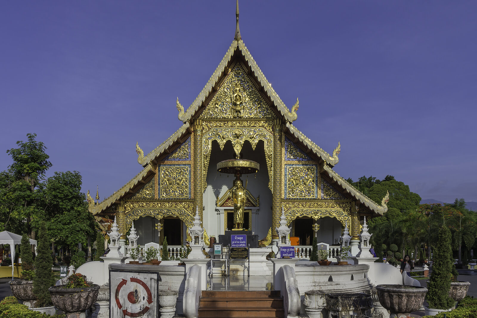 Wihan Lai Kham at Wat Phra Singh, with a golden pediment and steps leading to the entrance.