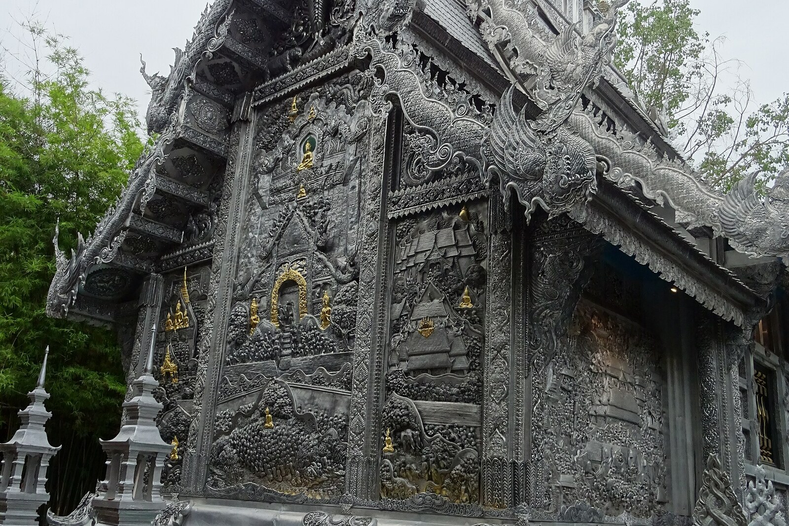The silvery façade of Wat Sri Suphan with repoussé metal panels.