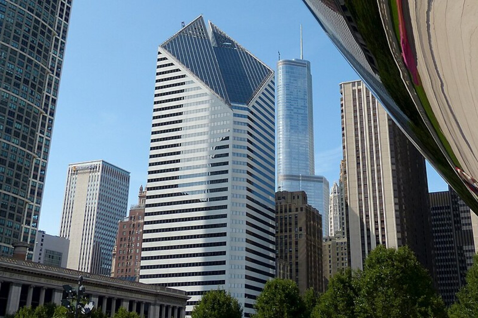 Cloud Gate in Millennium Park with the city reflected in it.