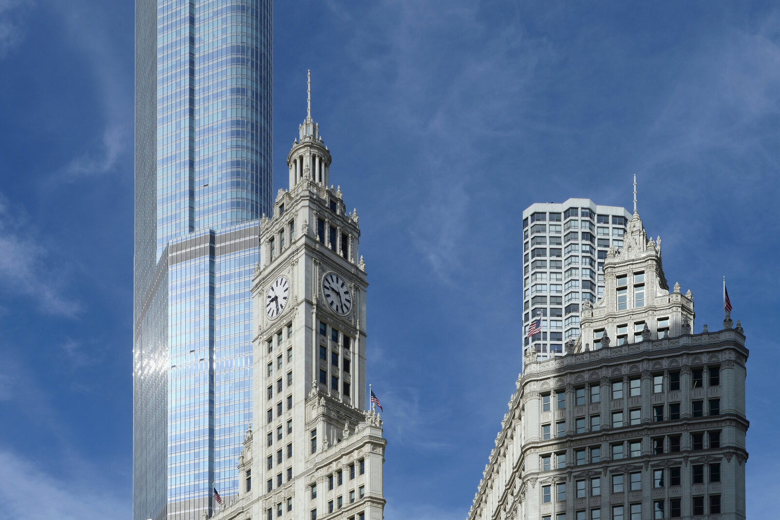 The Wrigley Building with white terracotta towers and clocks.