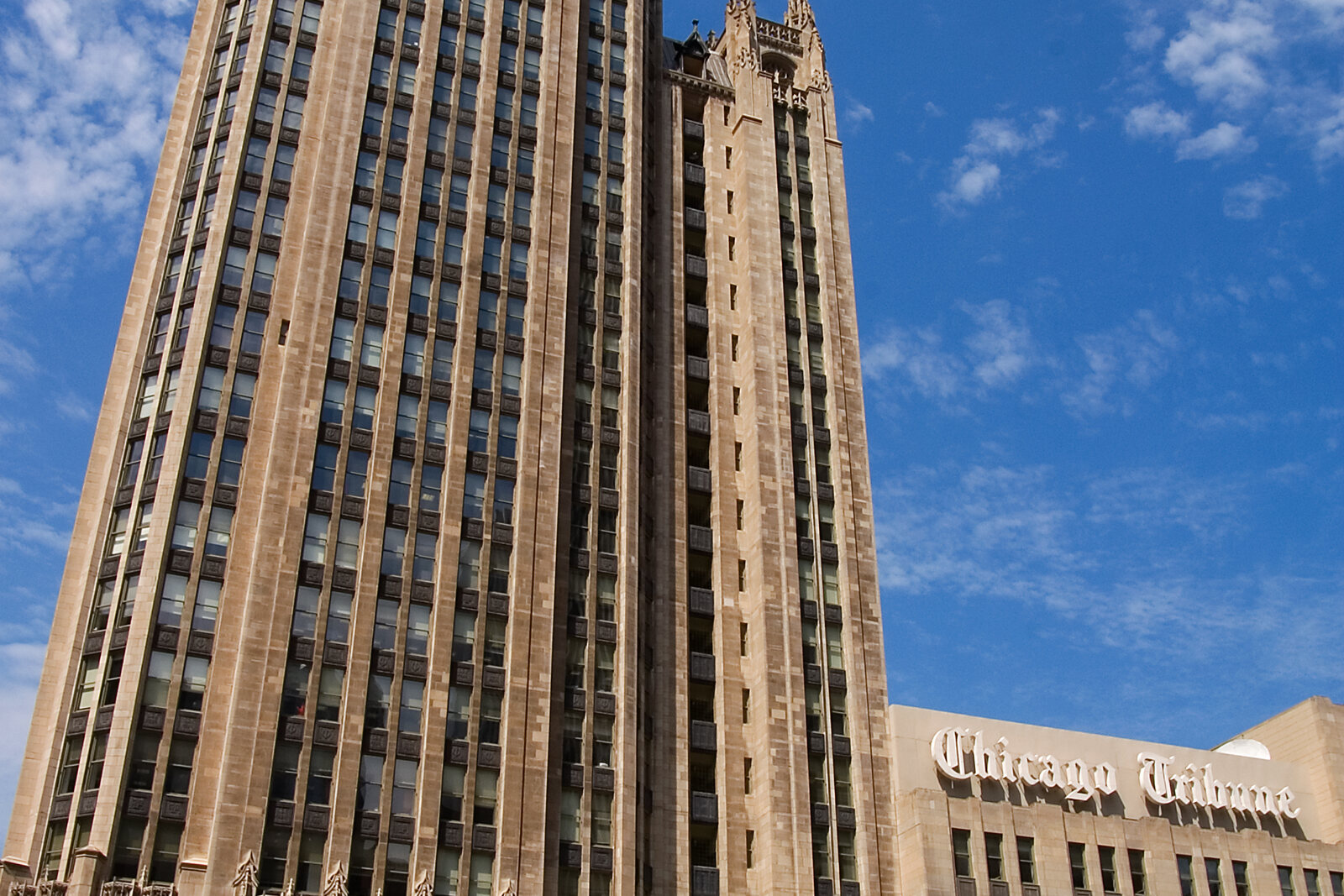 Tribune Tower with its Gothic crown and stone facade.