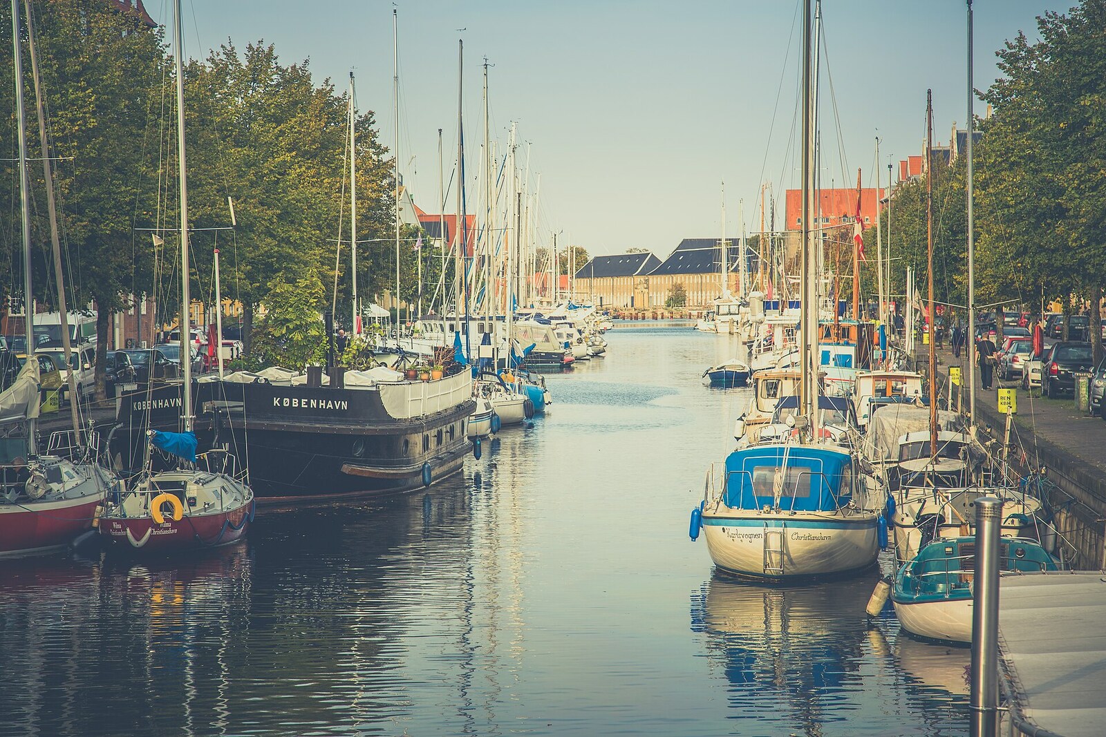 Christianshavns Kanal with boats and colorful houses.