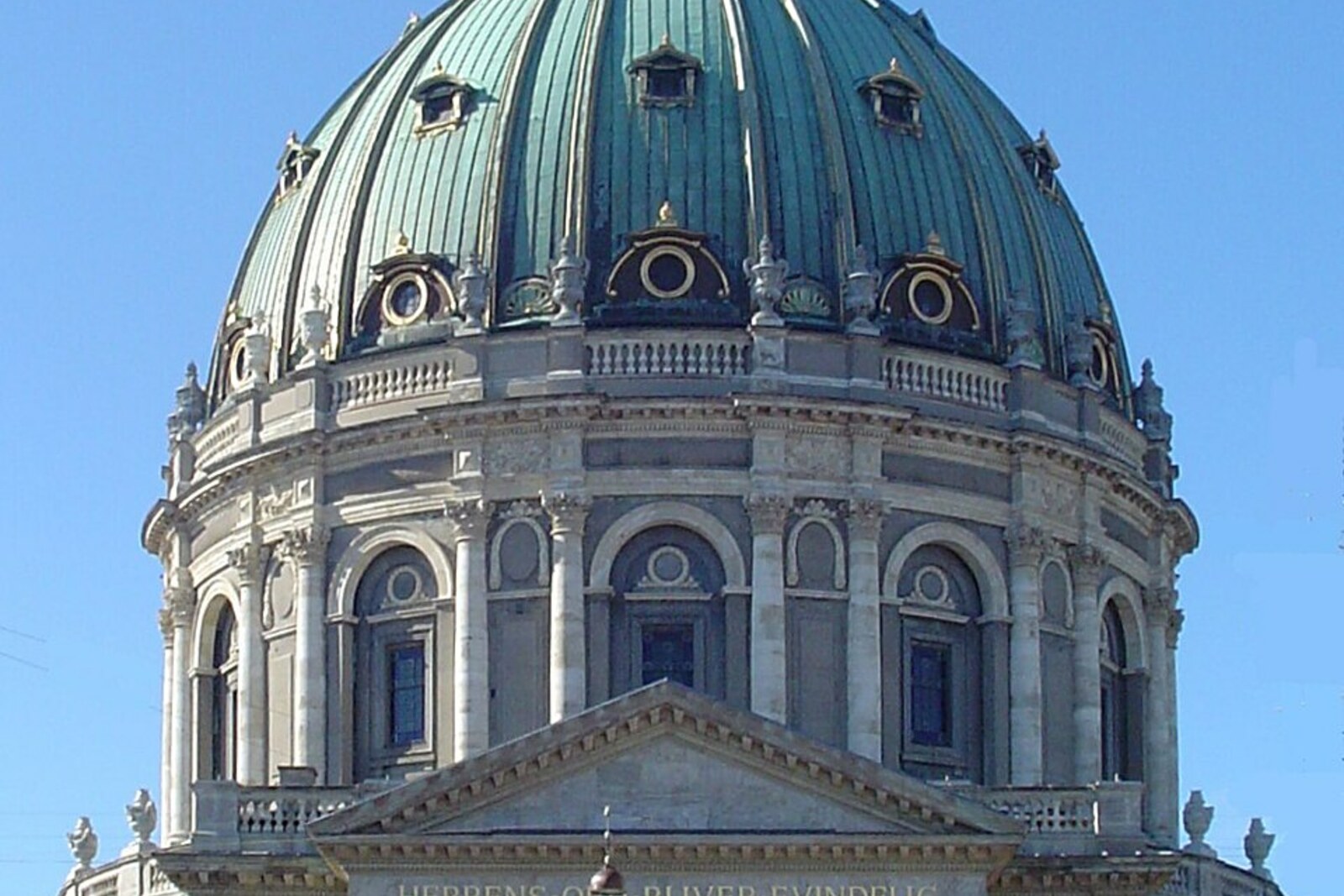 View of the front façade of Frederik's Church with a large dome and columns