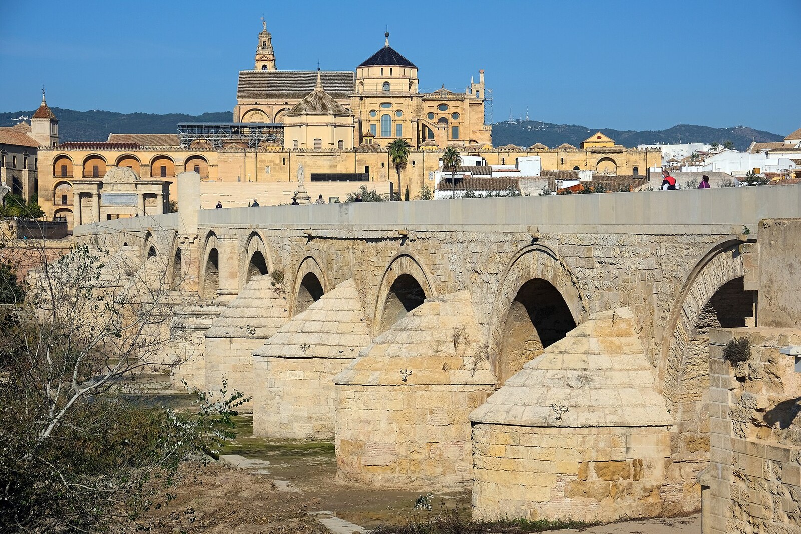 The stone spans of the Roman Bridge across the Guadalquivir.