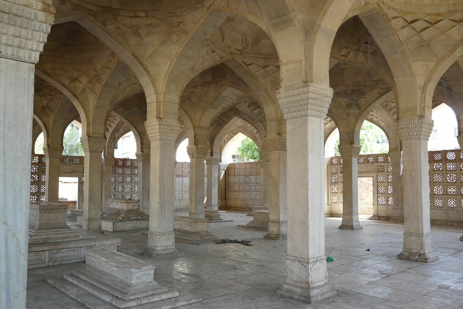 A marble hall with columns and a vault in Chausath Khamba.