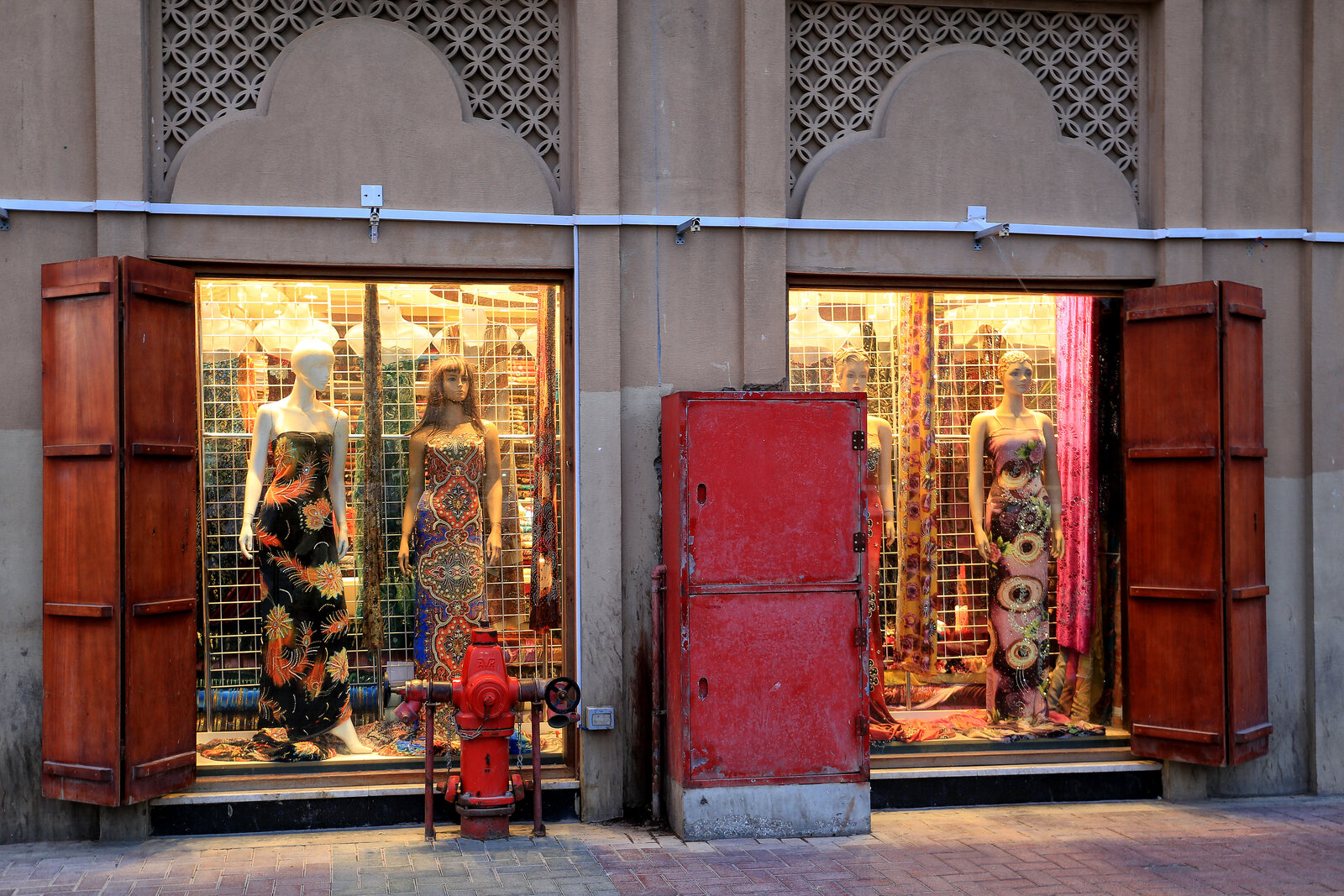 Textile Souk in Bur Dubai: fabric shops beneath a wooden canopy.