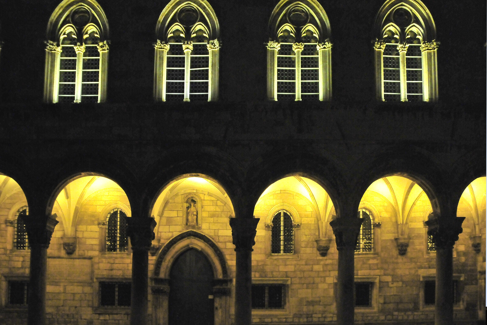 Dubrovnik's Rector's Palace with arcades and a stone facade.