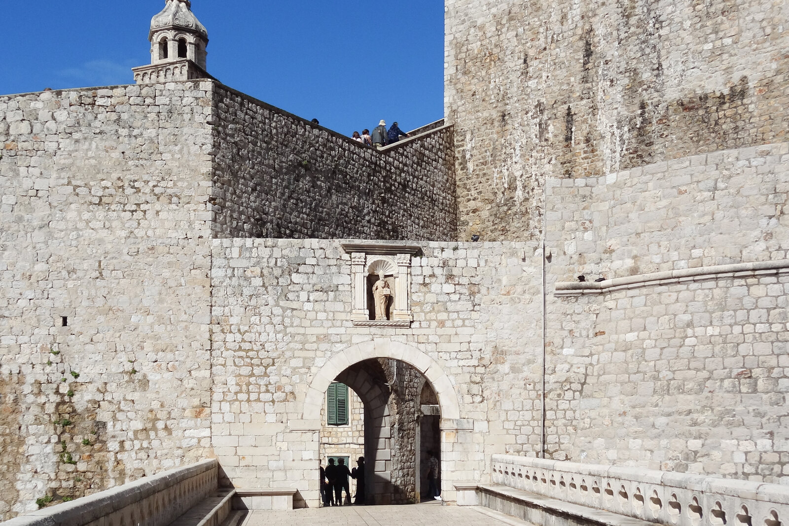 Ploče Gate with its stone bridge and the wall at Dubrovnik's eastern entrance.