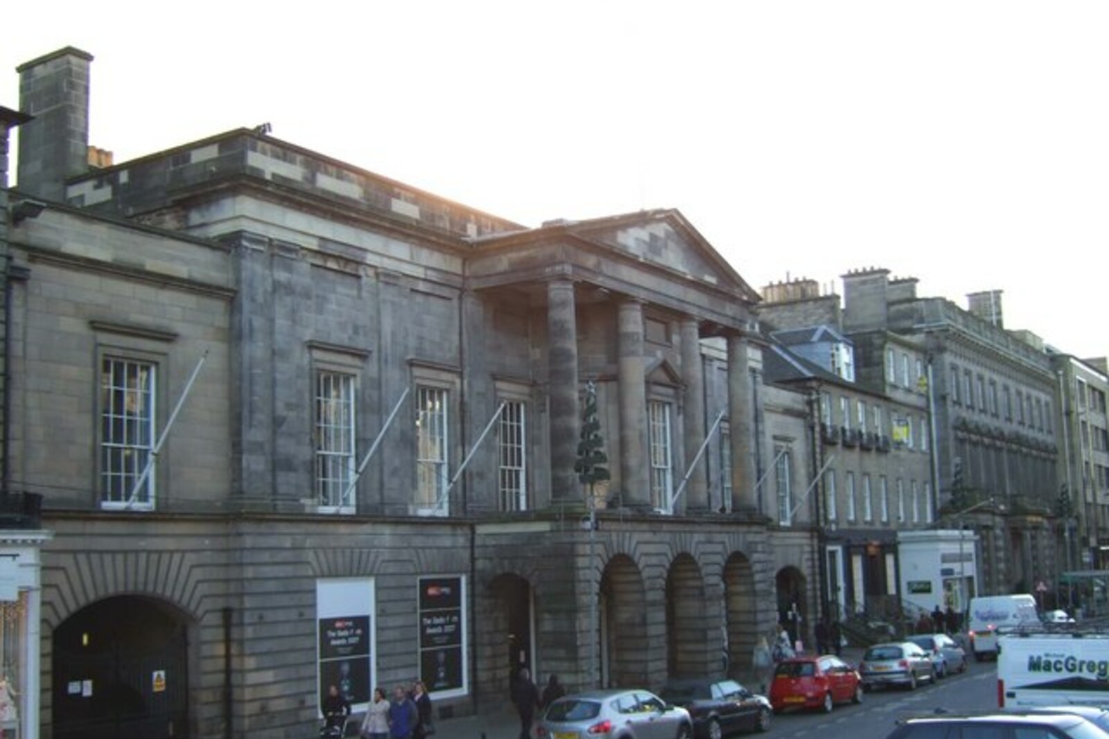 The neoclassical facade of the Assembly Rooms on George Street, with columns and windows.