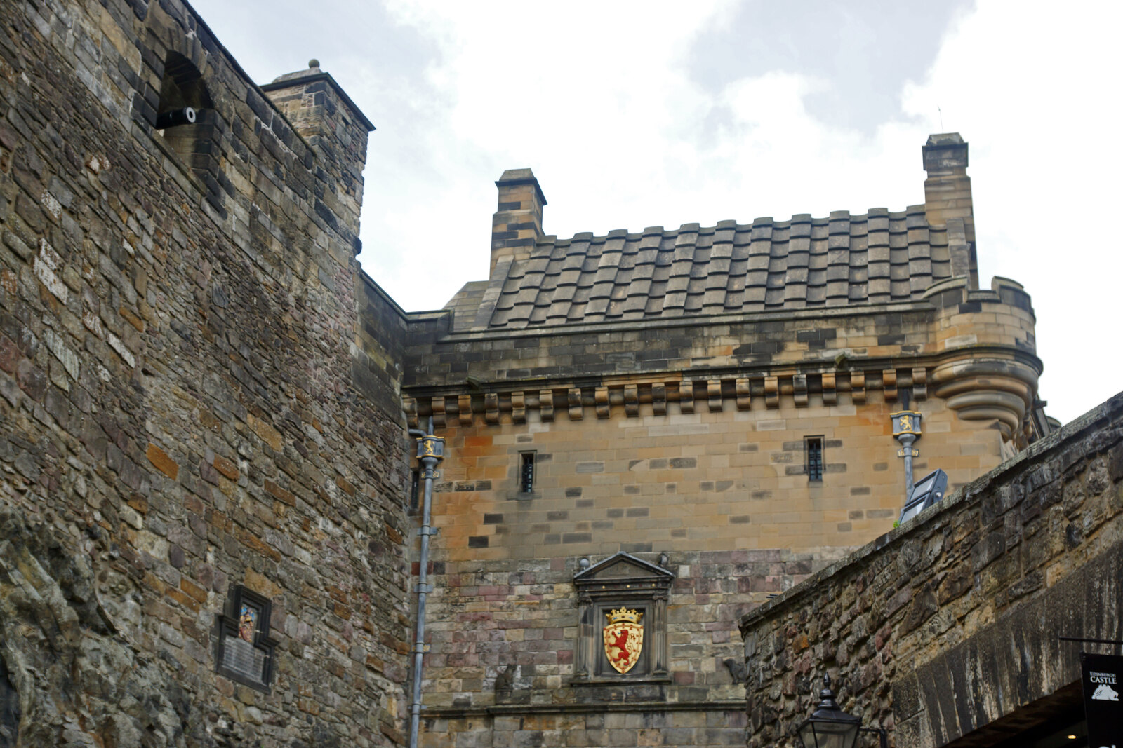 Edinburgh Castle on Castle Rock on a clear day, seen from outside at the beginning of the Royal Mile.