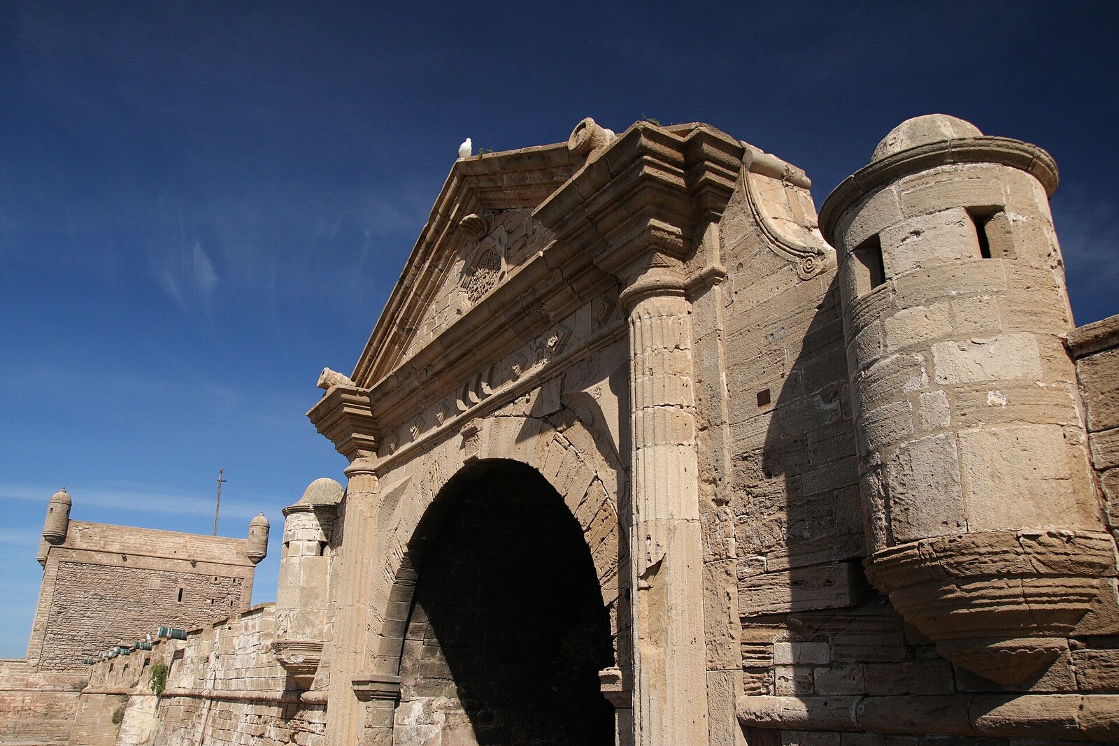 The stone Bab el-Marsa gate by the port fortifications of Essaouira.