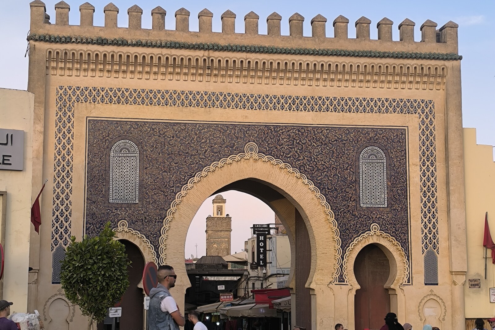 Bab Bou Jeloud gate with blue mosaic tilework and a central arch.