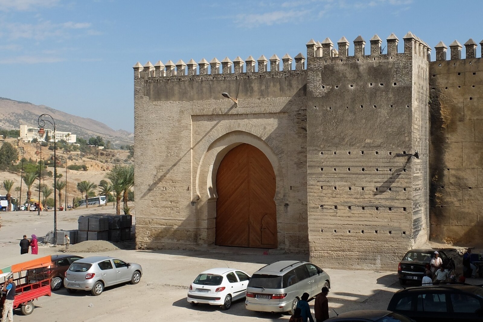 Bab Mahrouk Gate with a large arch and a thick earthen facade